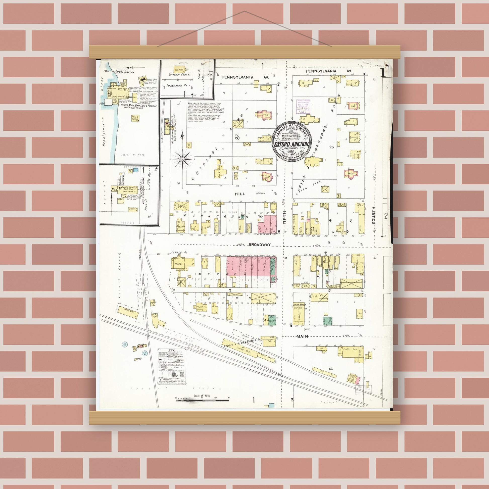 Old map wall art mockup — magnetic wood frame on brick wall — Sanborn Fire Insurance Map from Oxford Junction, Jones County, Iowa (1905), Sheet #0001