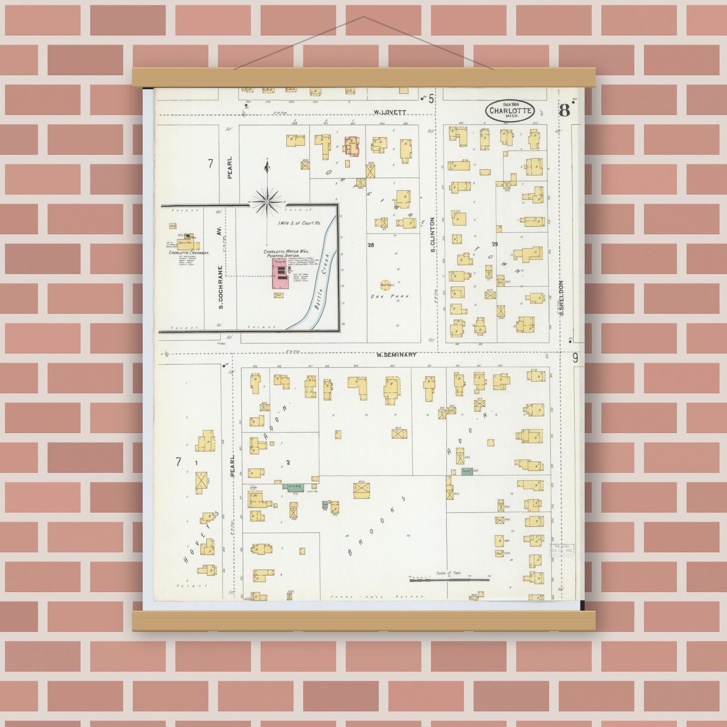 Old map wall art mockup — magnetic wood frame on brick wall — Sanborn Fire Insurance Map from Charlotte, Eaton County, Michigan (1904), Sheet #0008