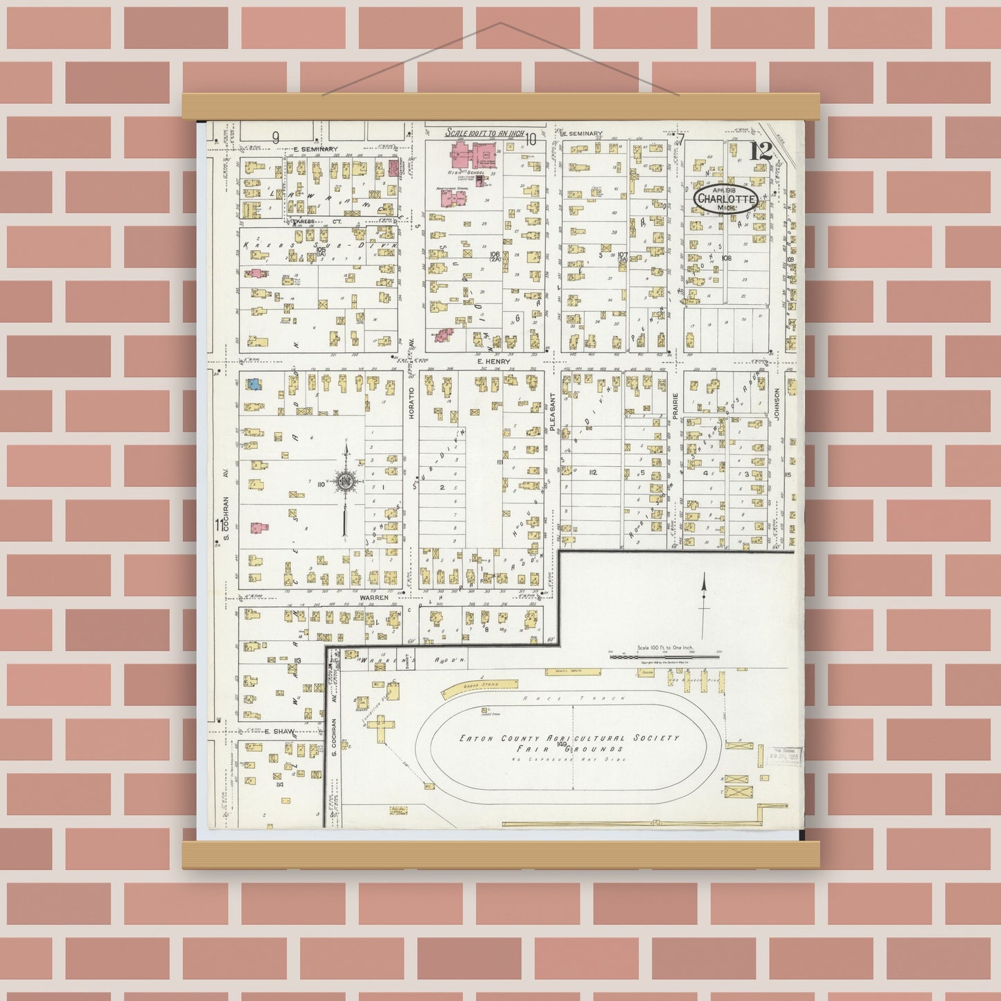 Old map wall art mockup — magnetic wood frame on brick wall — Sanborn Fire Insurance Map from Charlotte, Eaton County, Michigan (1918), Sheet #0012