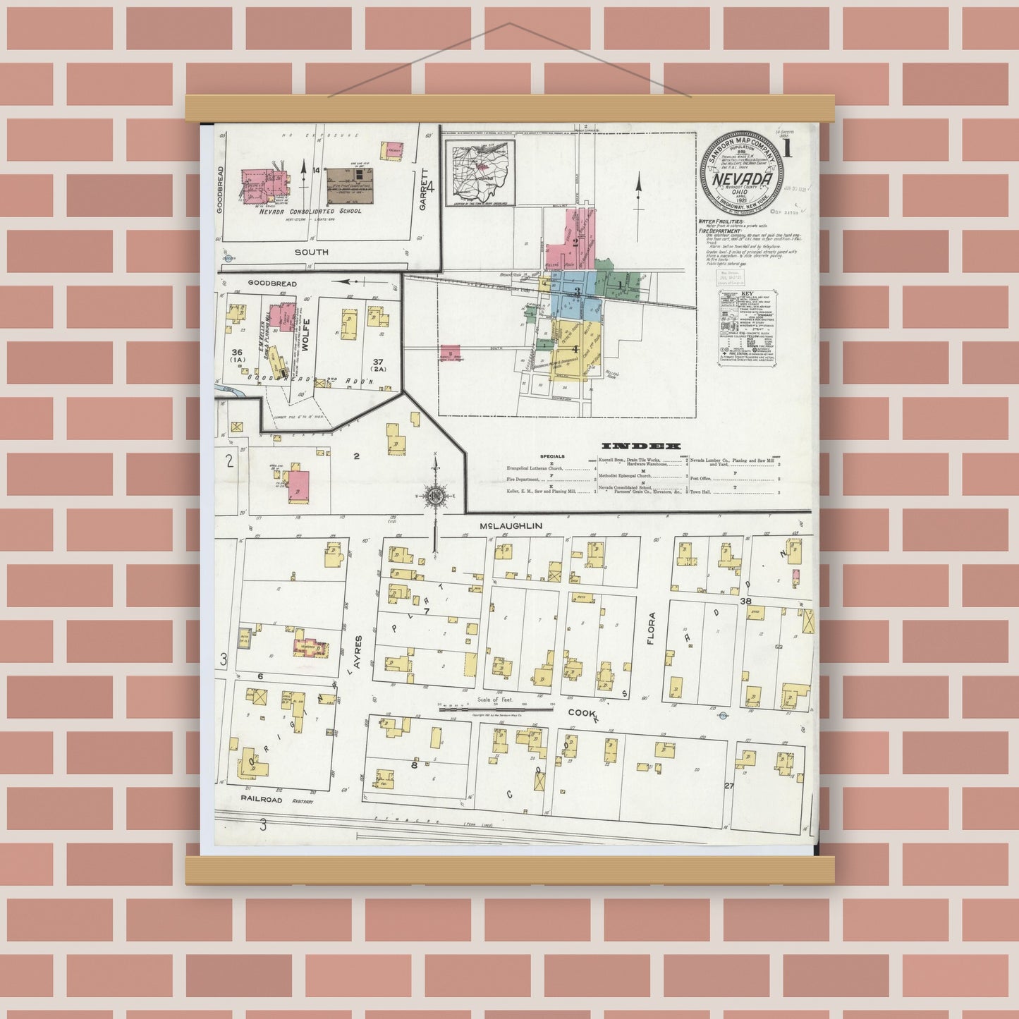 Old map wall art mockup — magnetic wood frame on brick wall — Sanborn Fire Insurance Map from Nevada, Wyandot County, Ohio (1921), Sheet #0001