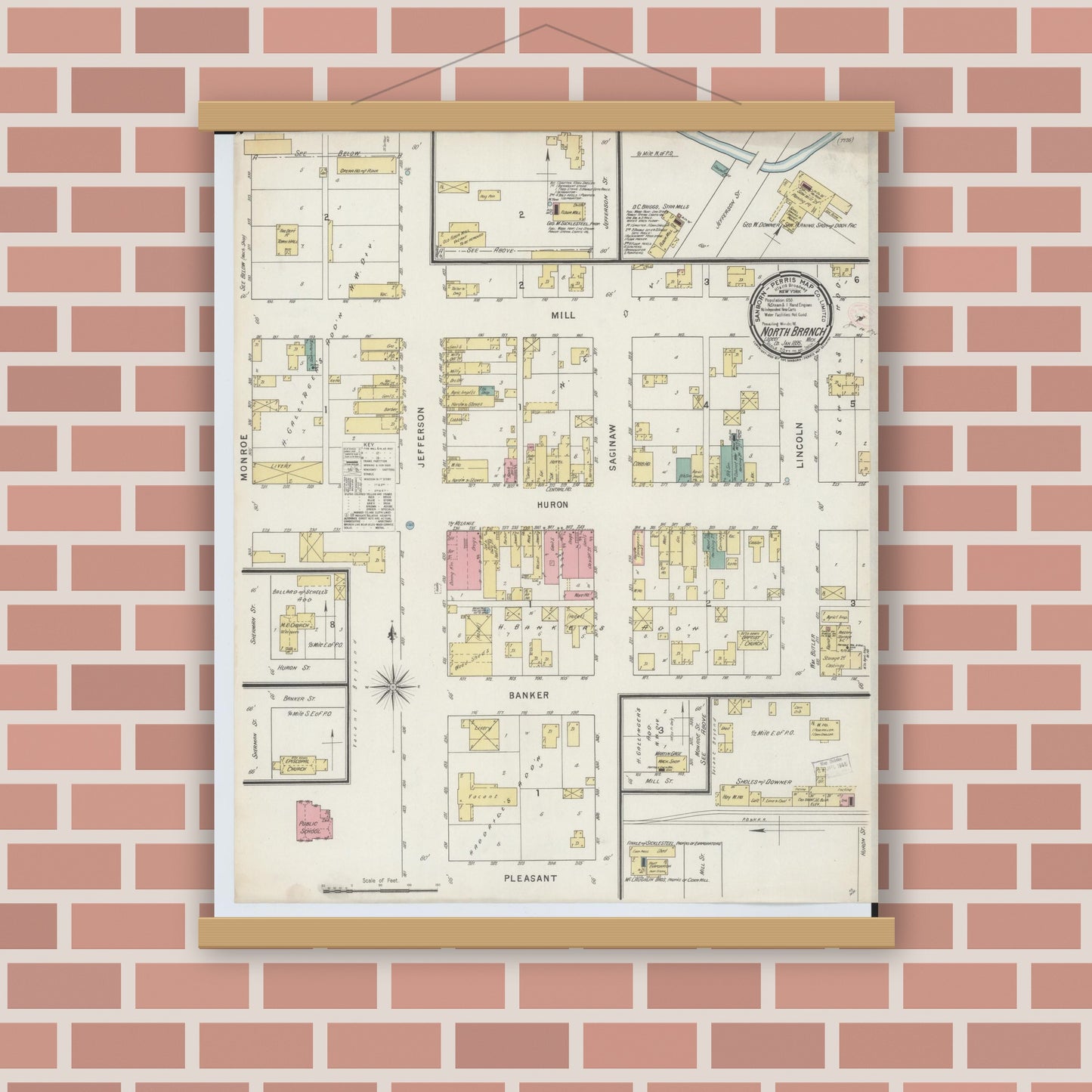 Old map wall art mockup — magnetic wood frame on brick wall — Sanborn Fire Insurance Map from North Branch, Lapeer County, Michigan (1895), Sheet #0001