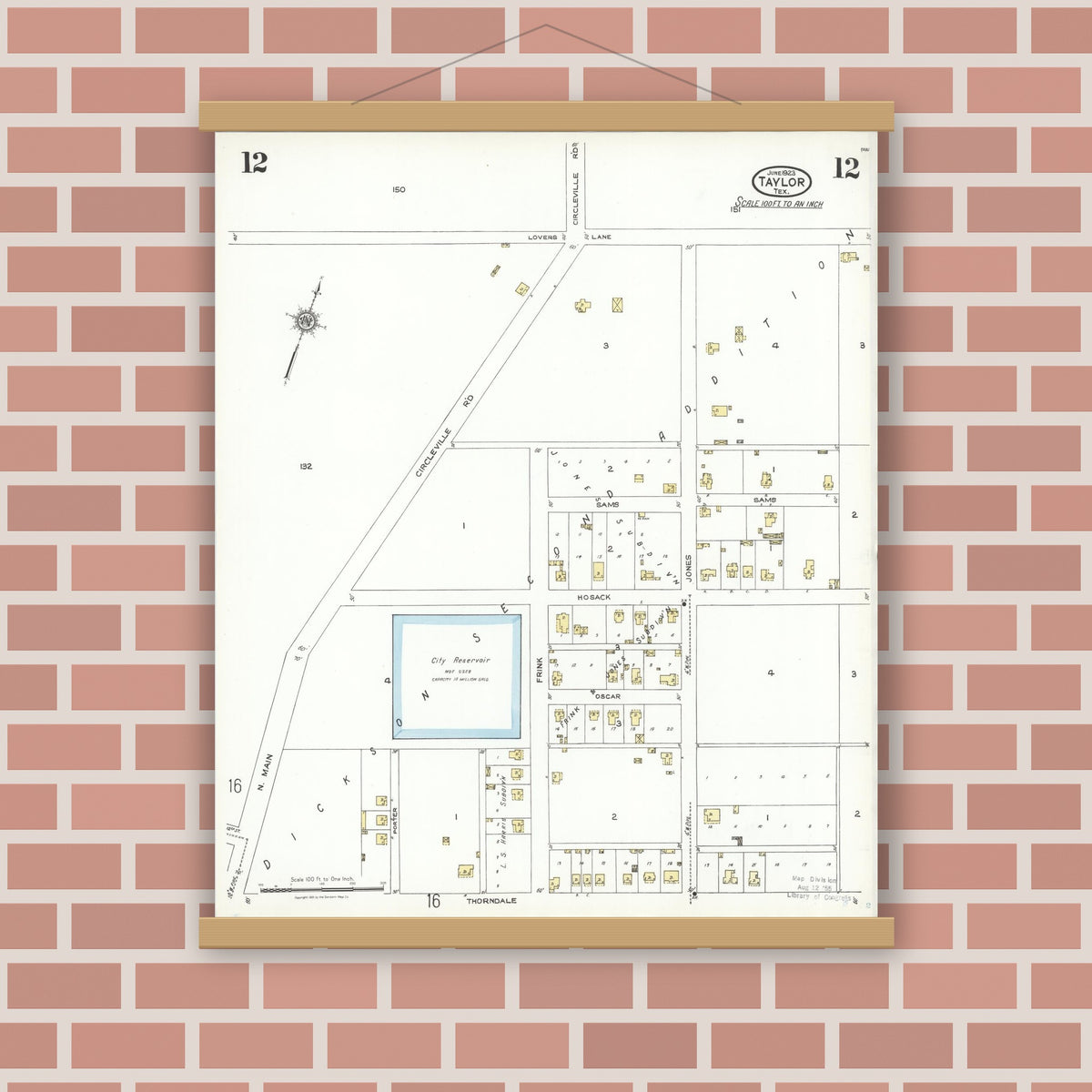 Old map wall art mockup — magnetic wood frame on brick wall — Sanborn Fire Insurance Map from Taylor, Williamson County, Texas (1923), Sheet #0012