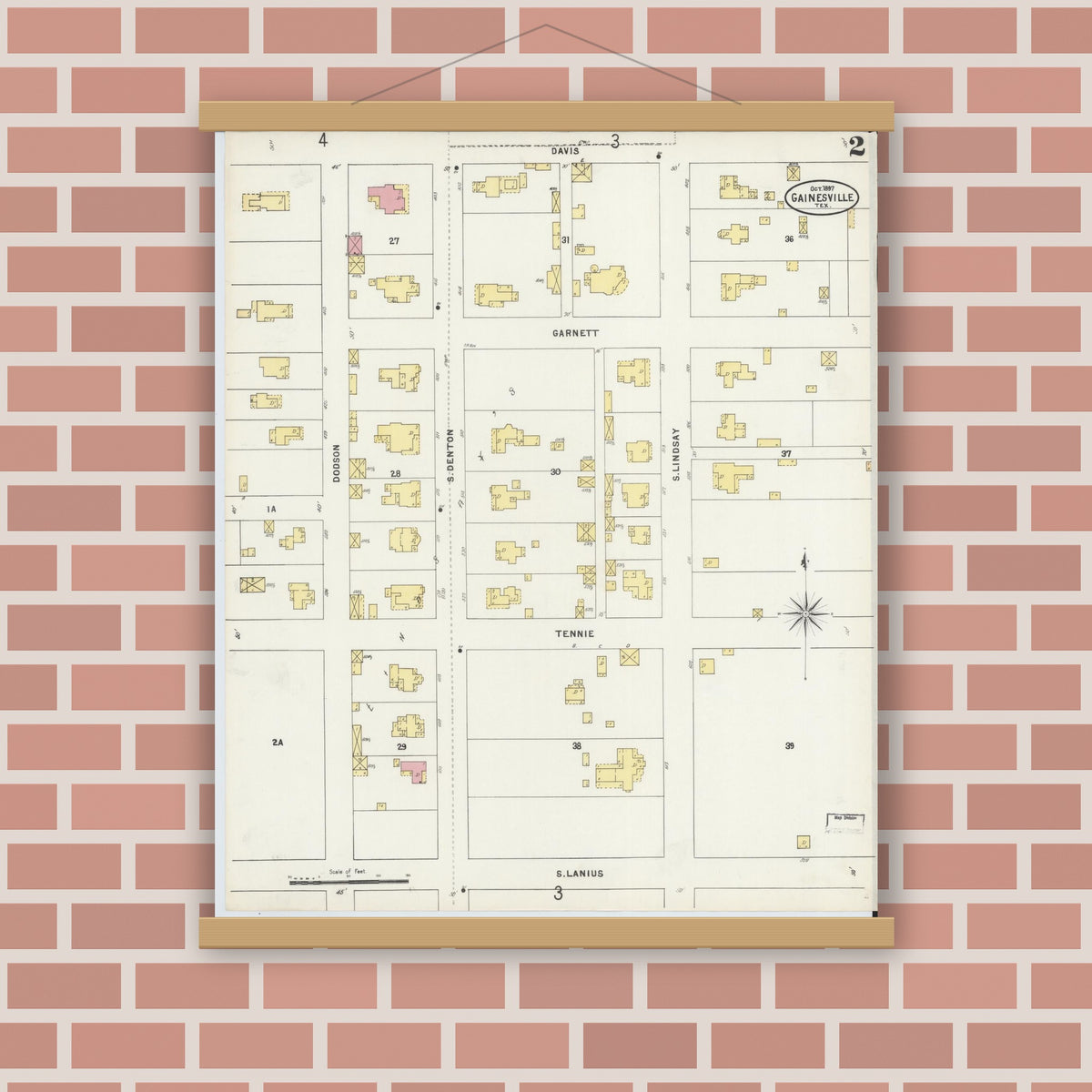 Old map wall art mockup — magnetic wood frame on brick wall — Sanborn Fire Insurance Map from Gainesville, Cooke County, Texas (1897), Sheet #0002