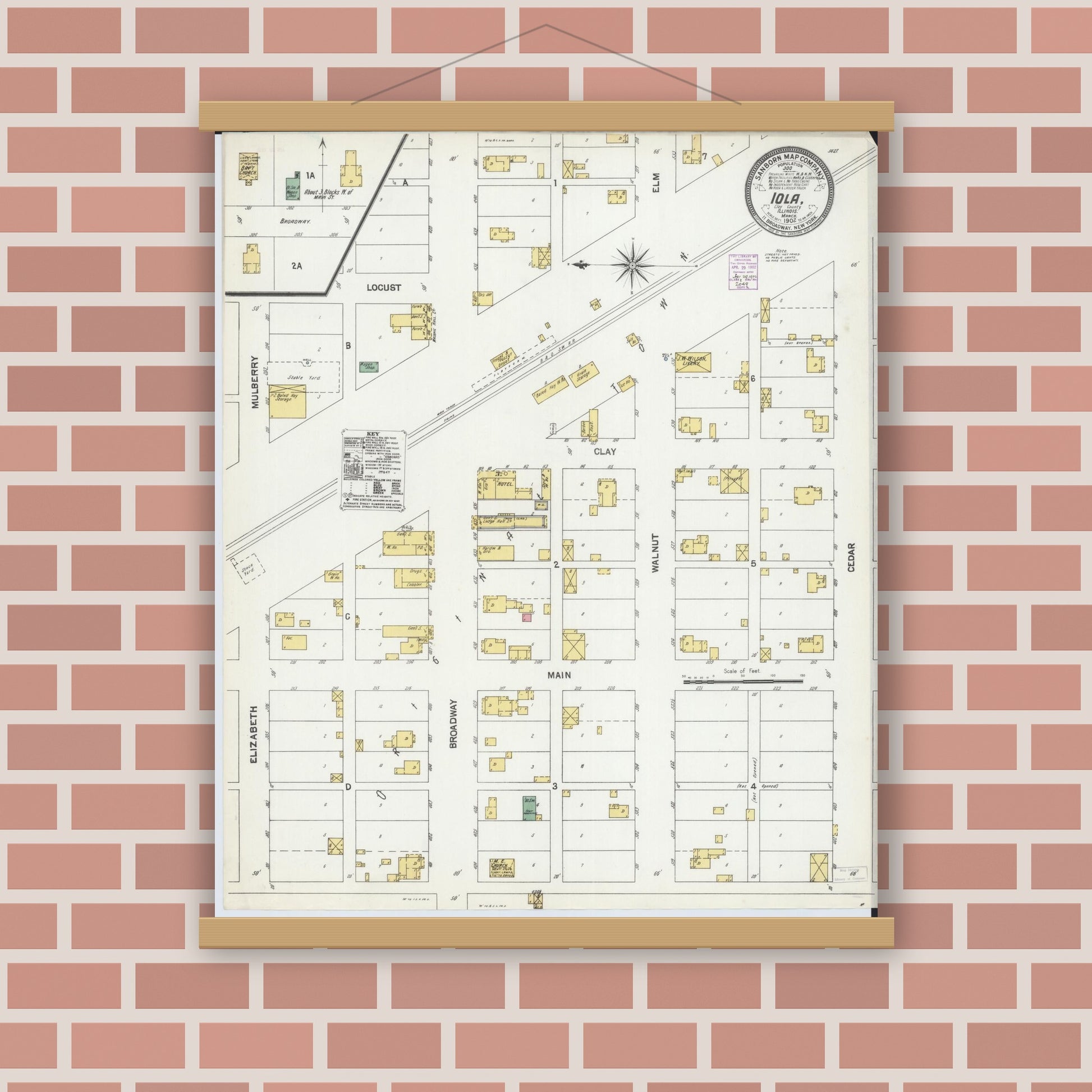 Old map wall art mockup — magnetic wood frame on brick wall — Sanborn Fire Insurance Map from Iola, Clay County, Illinois (1902), Sheet #0001