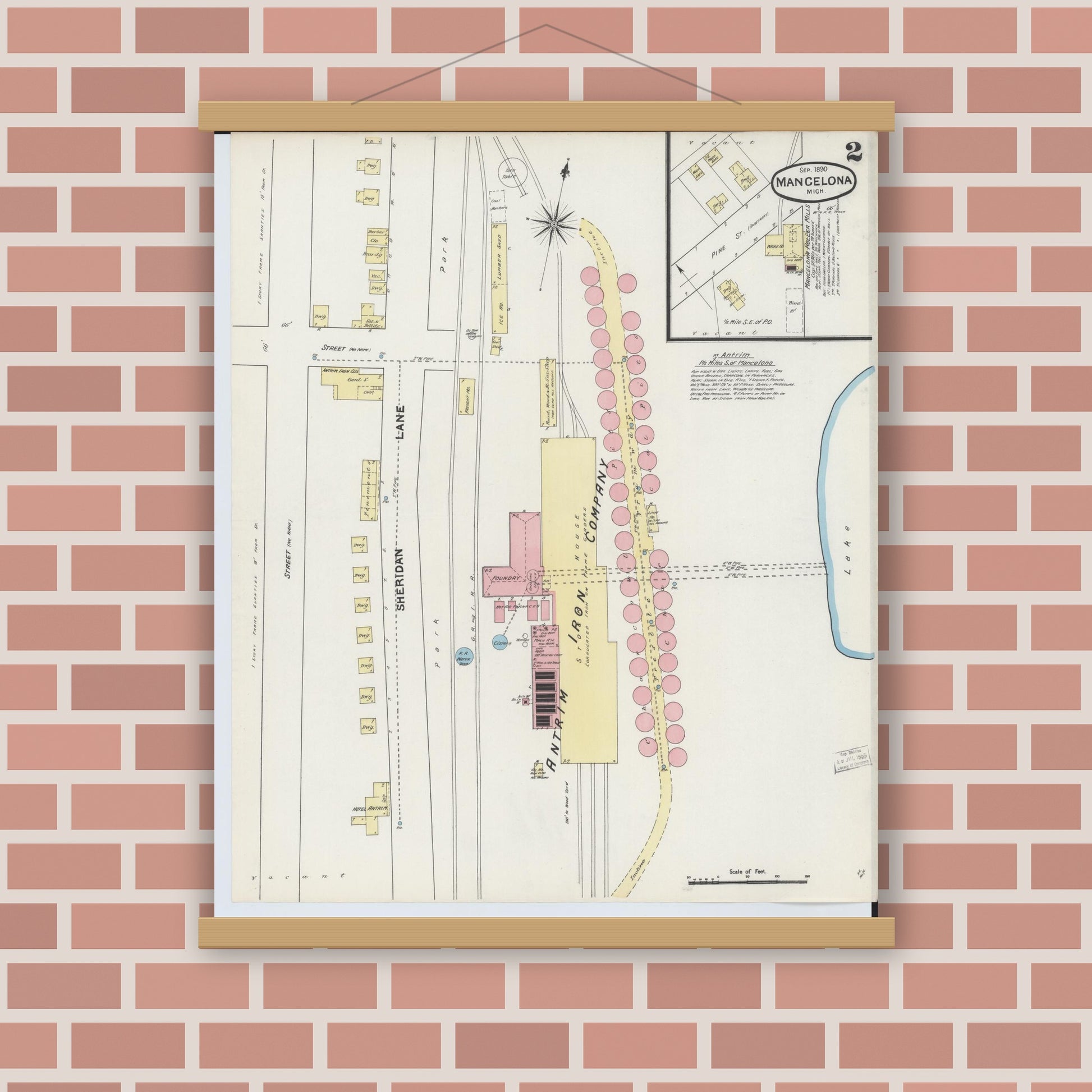 Old map wall art mockup — magnetic wood frame on brick wall — Sanborn Fire Insurance Map from Mancelona, Antrim County, Michigan (1890), Sheet #0002