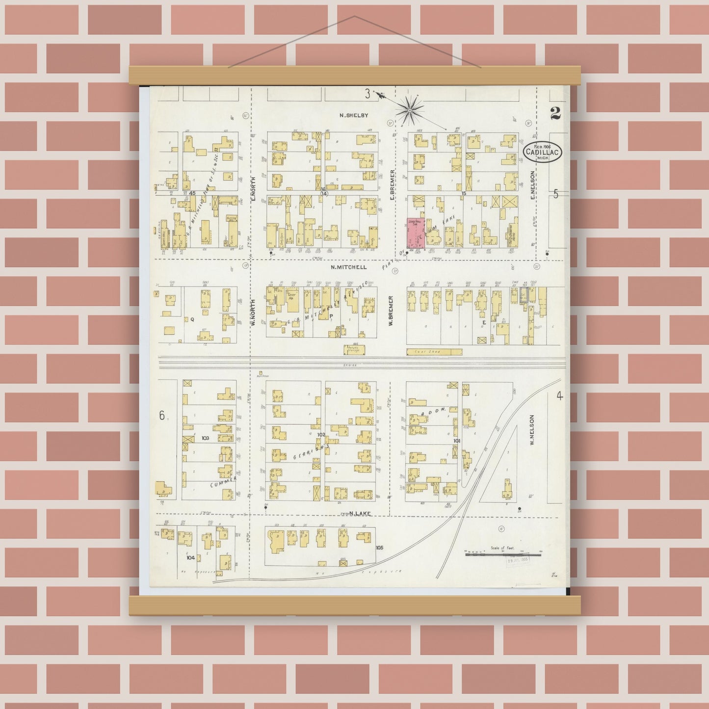 Old map wall art mockup — magnetic wood frame on brick wall — Sanborn Fire Insurance Map from Cadillac, Wexford County, Michigan (1906), Sheet #0002