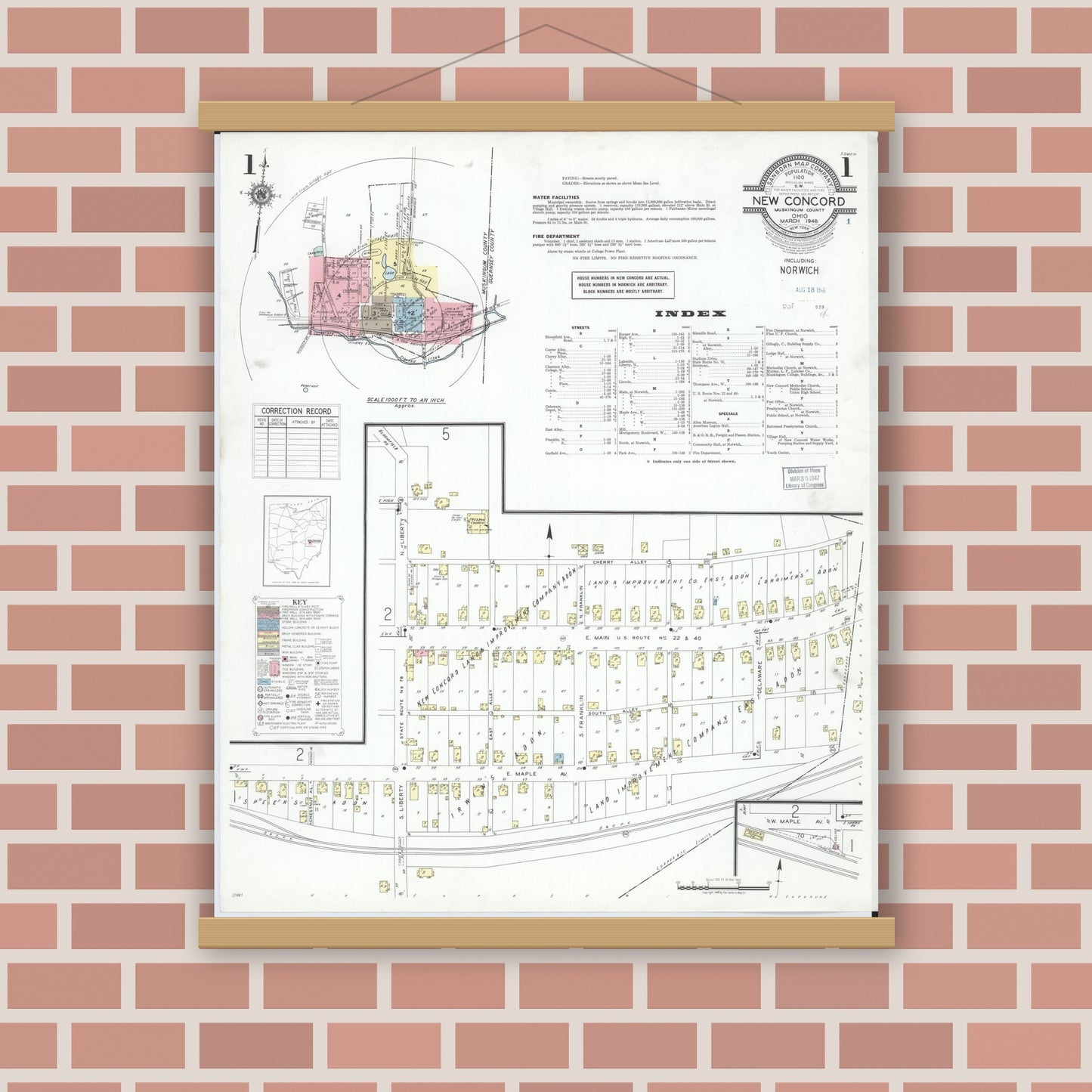 Old map wall art mockup — magnetic wood frame on brick wall — Sanborn Fire Insurance Map from New Concord, Muskingum County, Ohio (1946), Sheet #0001