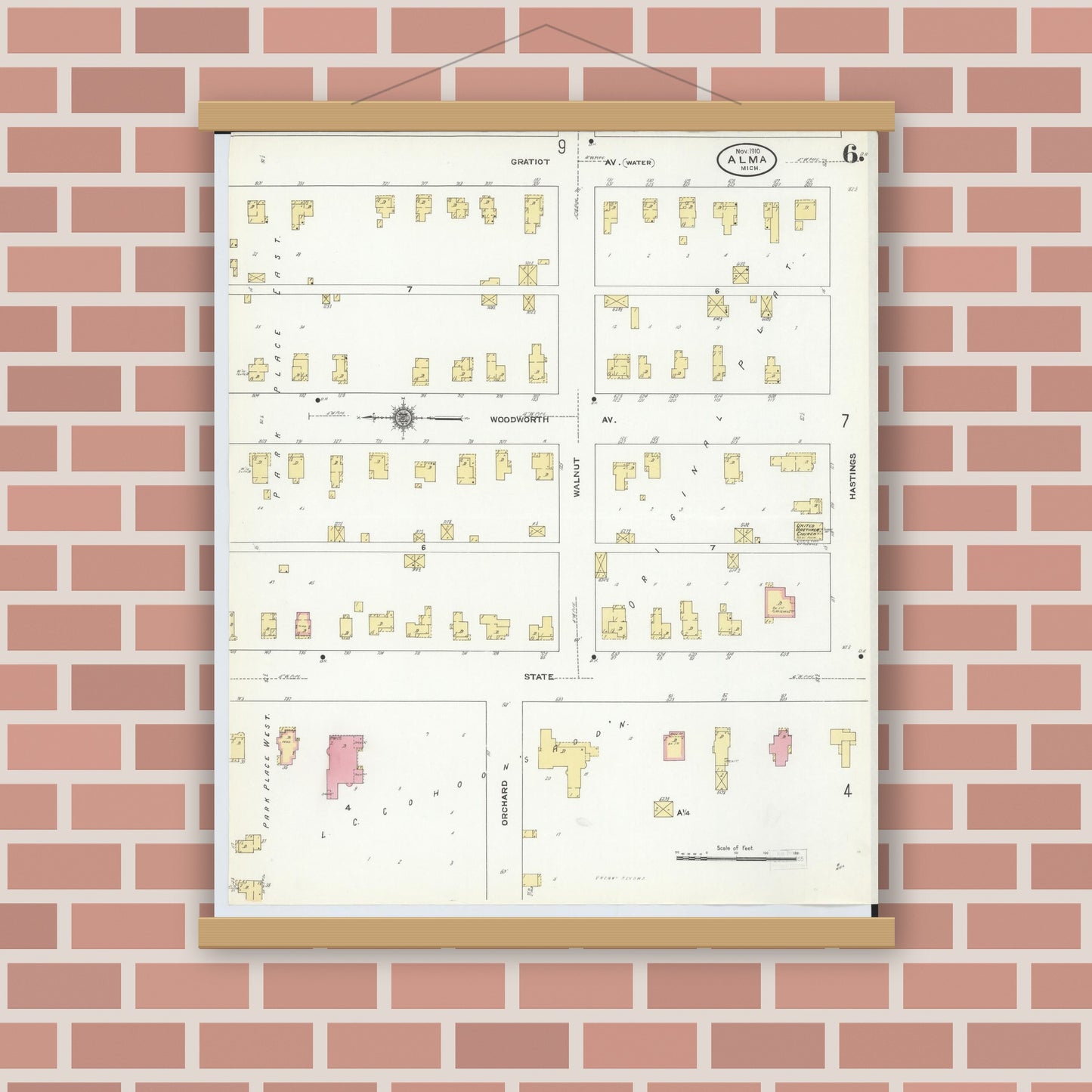 Old map wall art mockup — magnetic wood frame on brick wall — Sanborn Fire Insurance Map from Alma, Gratiot County, Michigan (1910), Sheet #0006