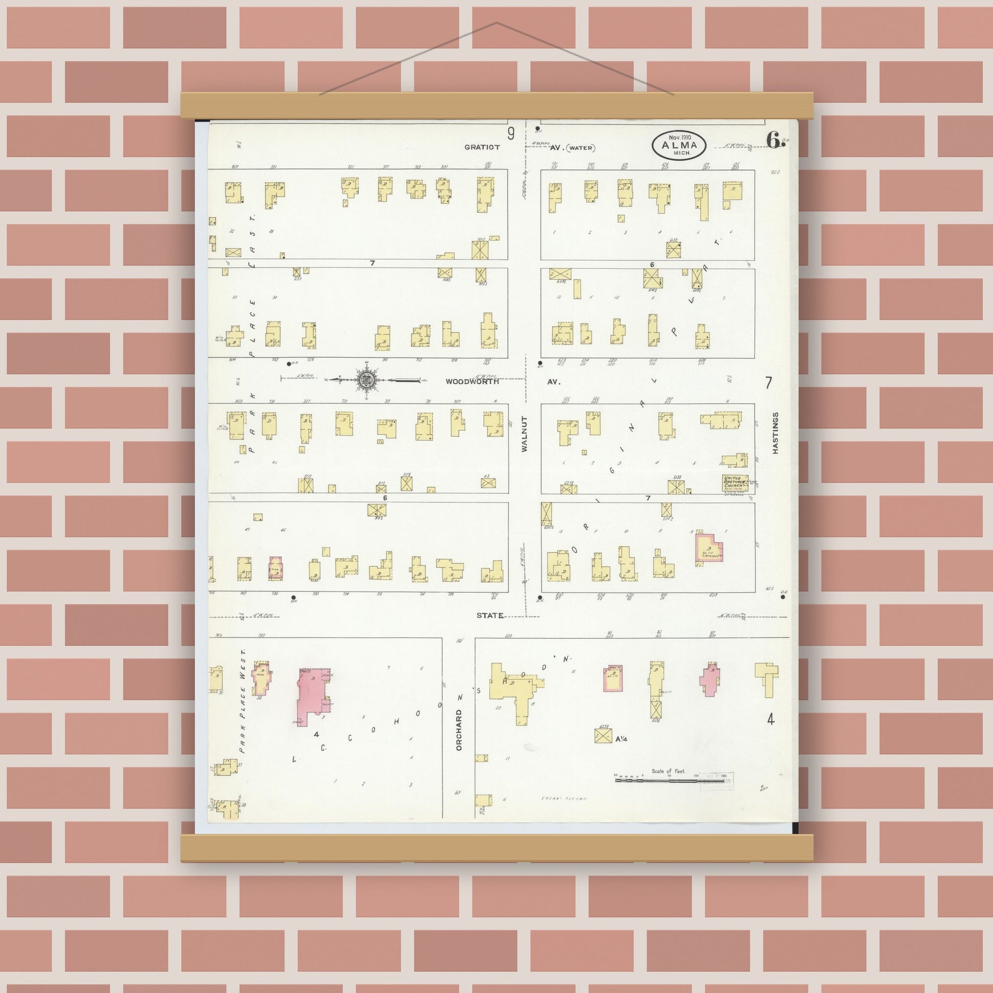Old map wall art mockup — magnetic wood frame on brick wall — Sanborn Fire Insurance Map from Alma, Gratiot County, Michigan (1910), Sheet #0006