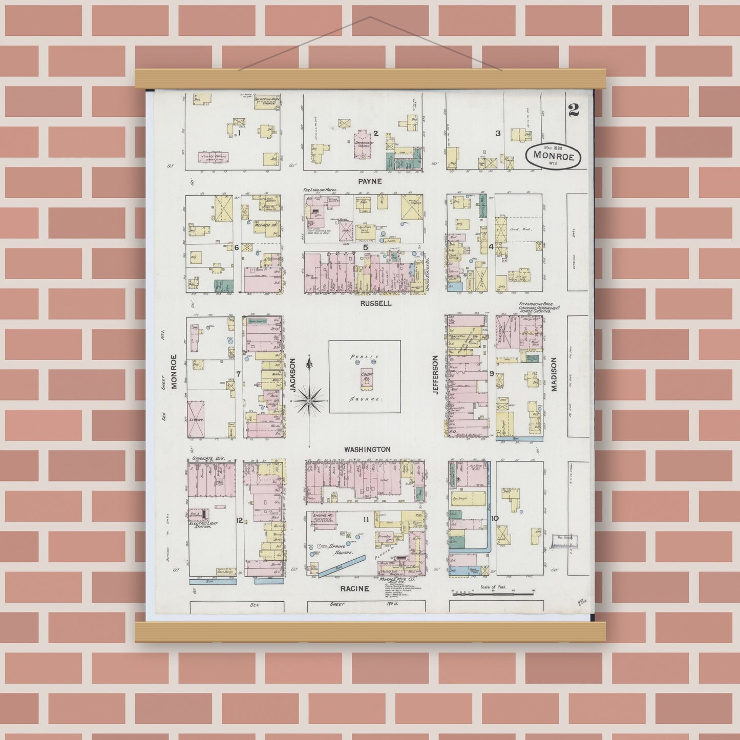 Old map wall art mockup — magnetic wood frame on brick wall — Sanborn Fire Insurance Map from Monroe, Green County, Wisconsin (1889), Sheet #0002
