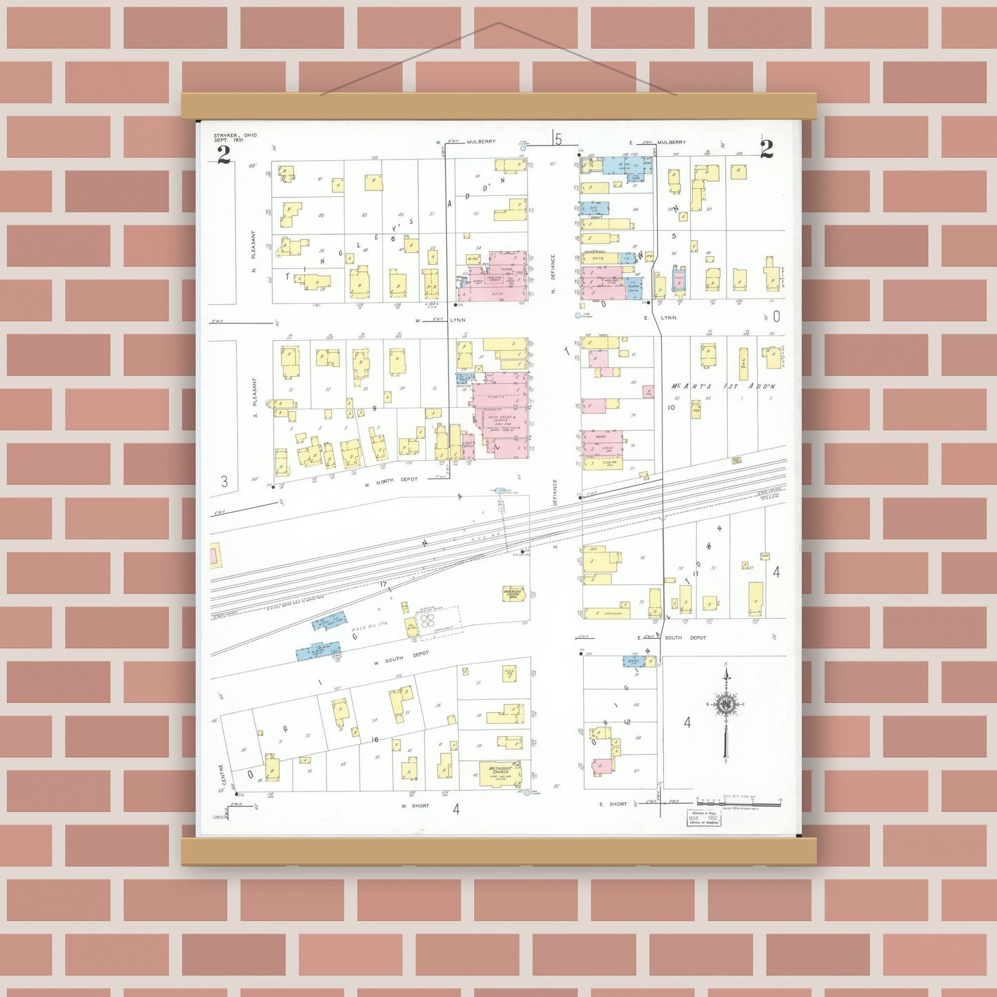 Old map wall art mockup — magnetic wood frame on brick wall — Sanborn Fire Insurance Map from Stryker, Williams County, Ohio (1951), Sheet #0002