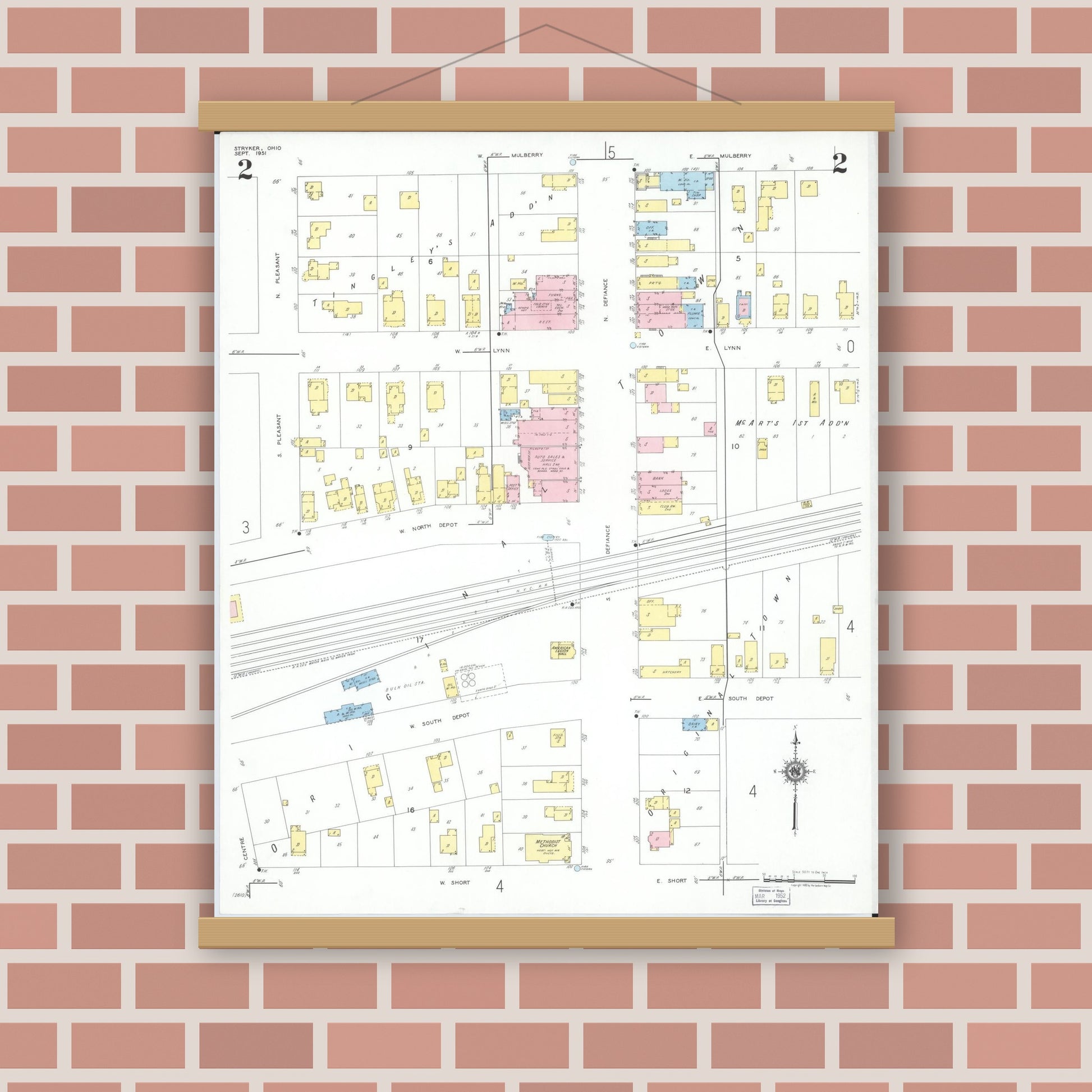 Old map wall art mockup — magnetic wood frame on brick wall — Sanborn Fire Insurance Map from Stryker, Williams County, Ohio (1951), Sheet #0002