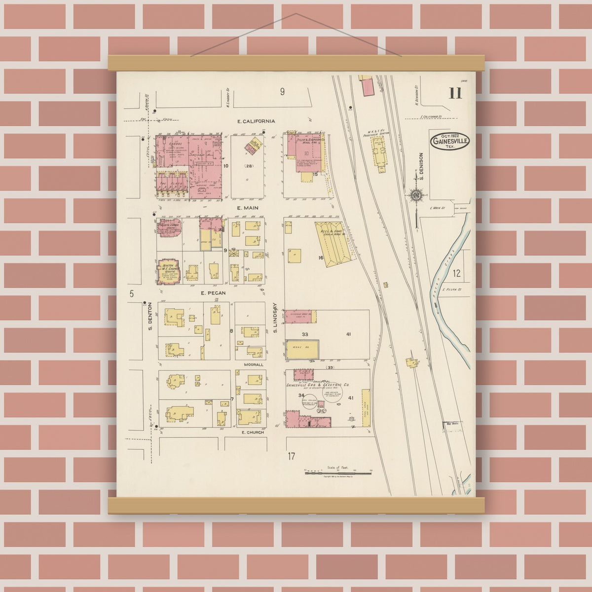 Old map wall art mockup — magnetic wood frame on brick wall — Sanborn Fire Insurance Map from Gainesville, Cooke County, Texas (1922), Sheet #0011