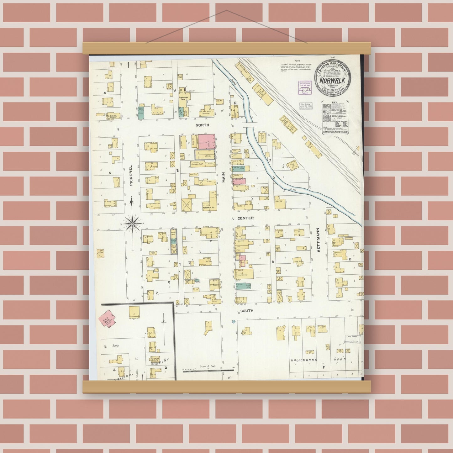 Old map wall art mockup — magnetic wood frame on brick wall — Sanborn Fire Insurance Map from Norwalk, Monroe County, Wisconsin (1904), Sheet #0001