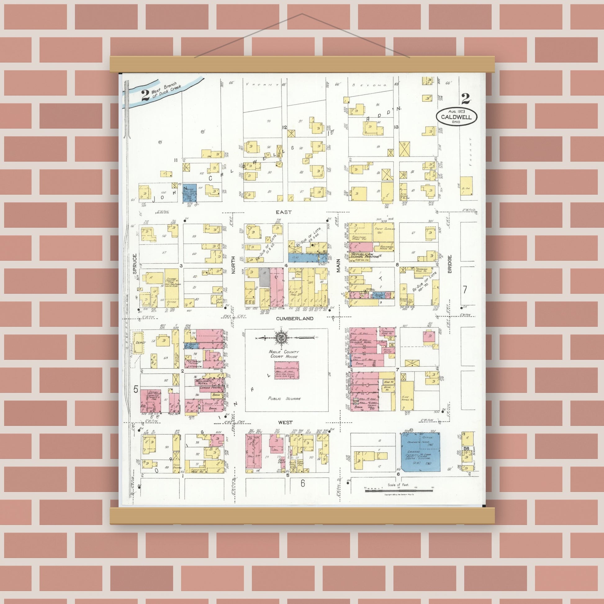 Old map wall art mockup — magnetic wood frame on brick wall — Sanborn Fire Insurance Map from Caldwell, Noble County, Ohio (1923), Sheet #0002