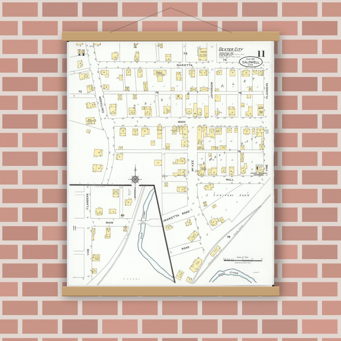 Old map wall art mockup — magnetic wood frame on brick wall — Sanborn Fire Insurance Map from Caldwell, Noble County, Ohio (1923), Sheet #0011