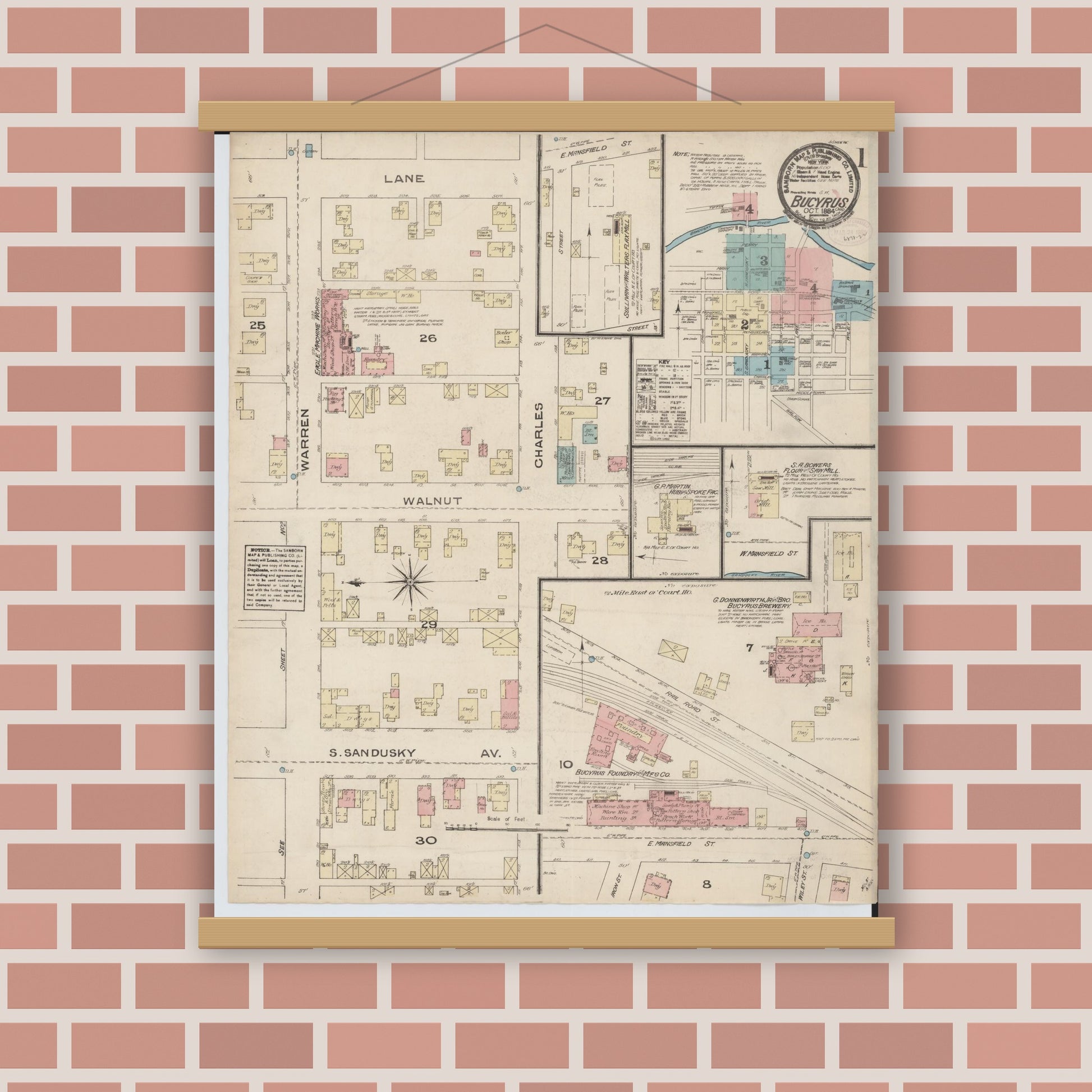 Old map wall art mockup — magnetic wood frame on brick wall — Sanborn Fire Insurance Map from Bucyrus, Crawford County, Ohio (1884), Sheet #0001