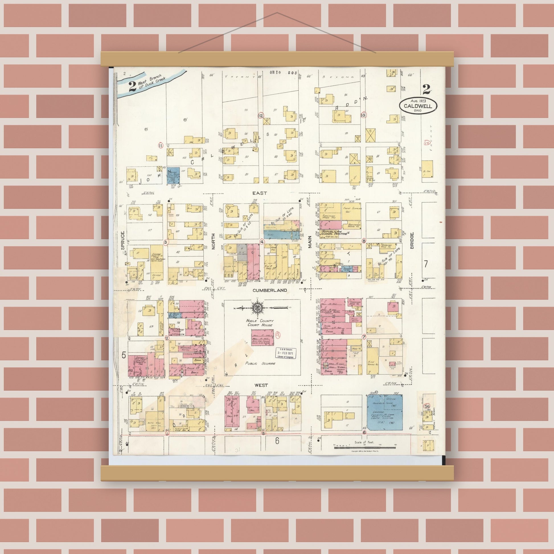 Old map wall art mockup — magnetic wood frame on brick wall — Sanborn Fire Insurance Map from Caldwell, Noble County, Ohio (1932), Sheet #0002