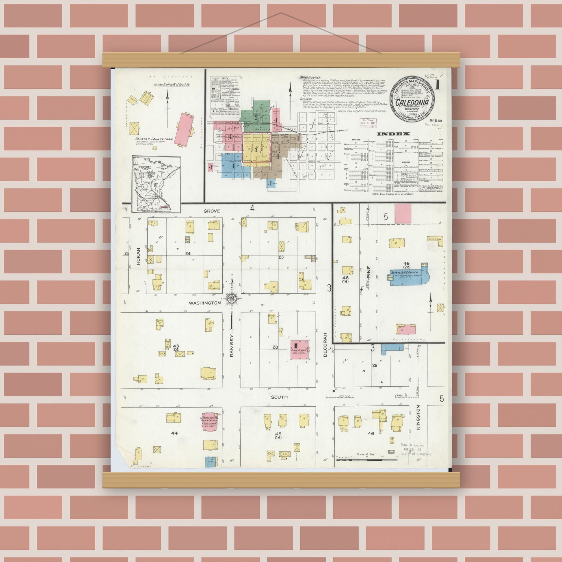 Old map wall art mockup — magnetic wood frame on brick wall — Sanborn Fire Insurance Map from Caledonia, Houston County, Minnesota (1915), Sheet #0001