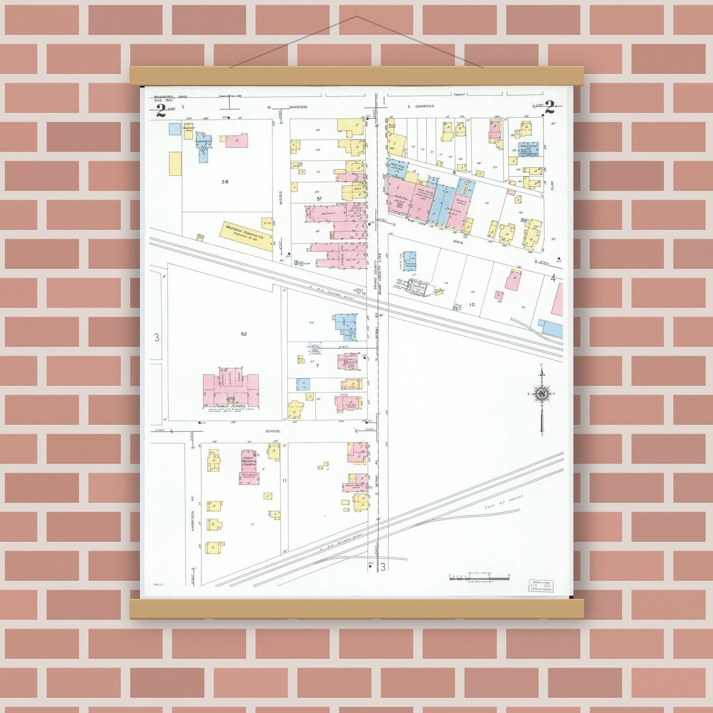Old map wall art mockup — magnetic wood frame on brick wall — Sanborn Fire Insurance Map from Bradford, Darke and Miami Counties, Ohio (1951), Sheet #0002
