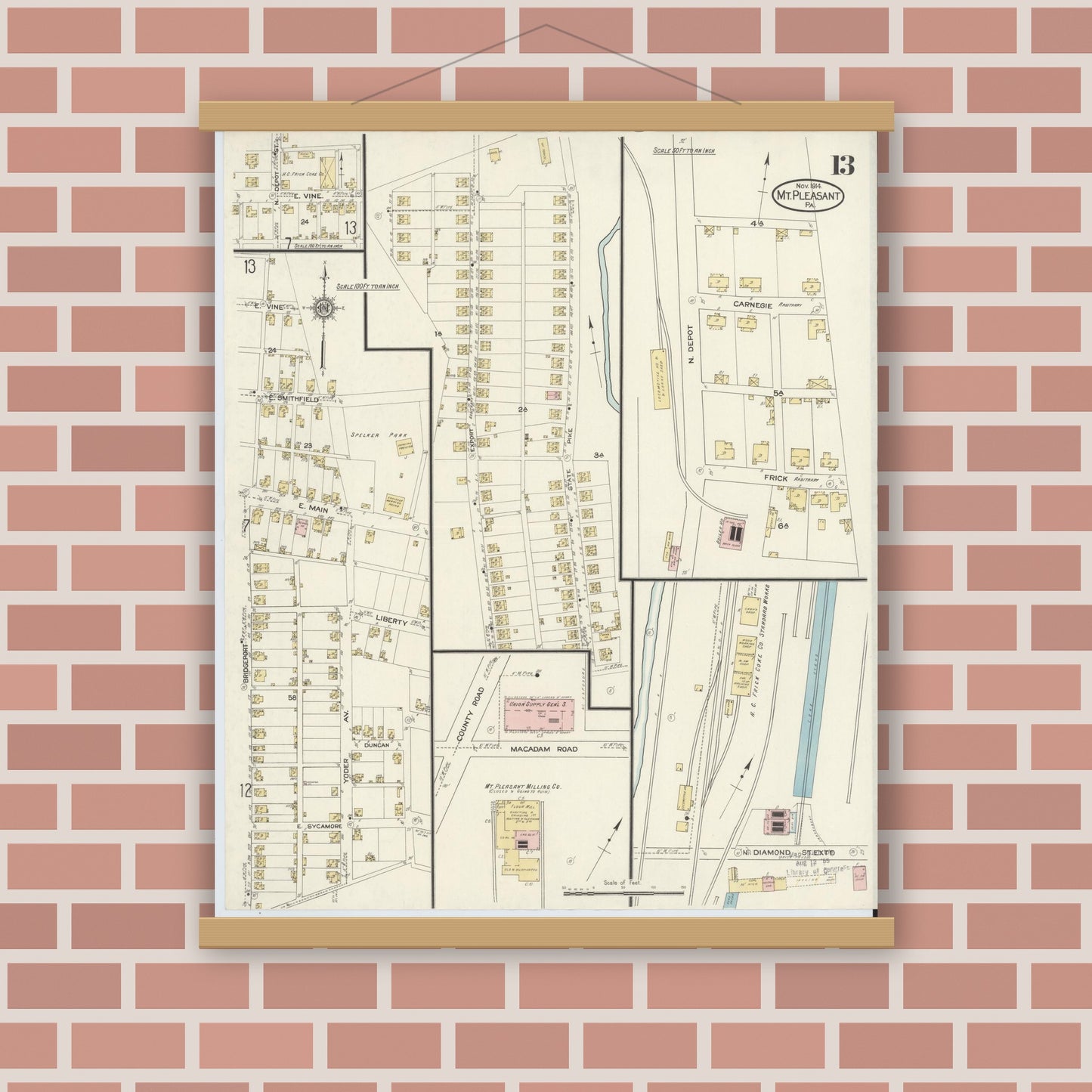 Old map wall art mockup — magnetic wood frame on brick wall — Sanborn Fire Insurance Map from Mount Pleasant, Westmoreland County, Pennsylvania (1914), Sheet #0013