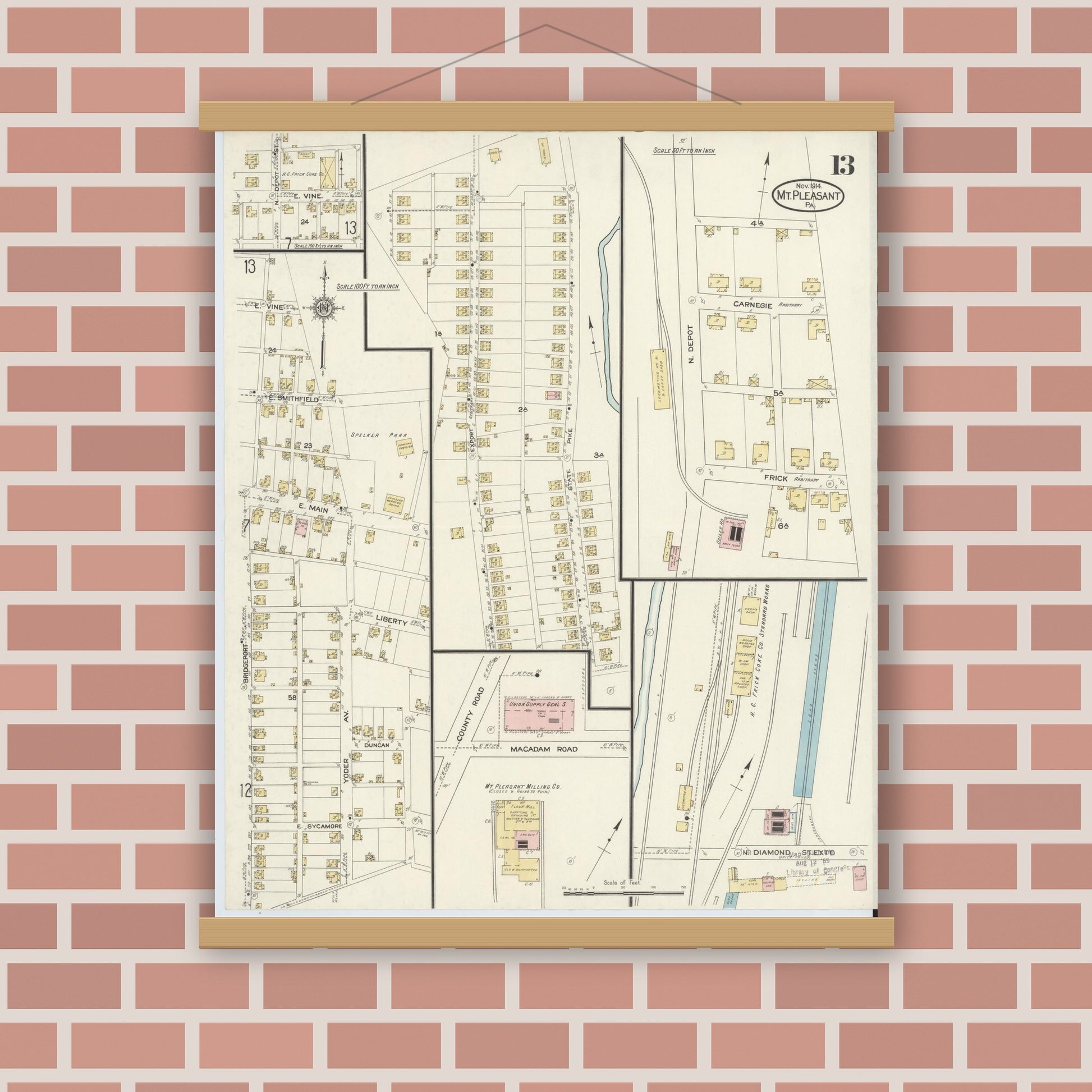 Old map wall art mockup — magnetic wood frame on brick wall — Sanborn Fire Insurance Map from Mount Pleasant, Westmoreland County, Pennsylvania (1914), Sheet #0013