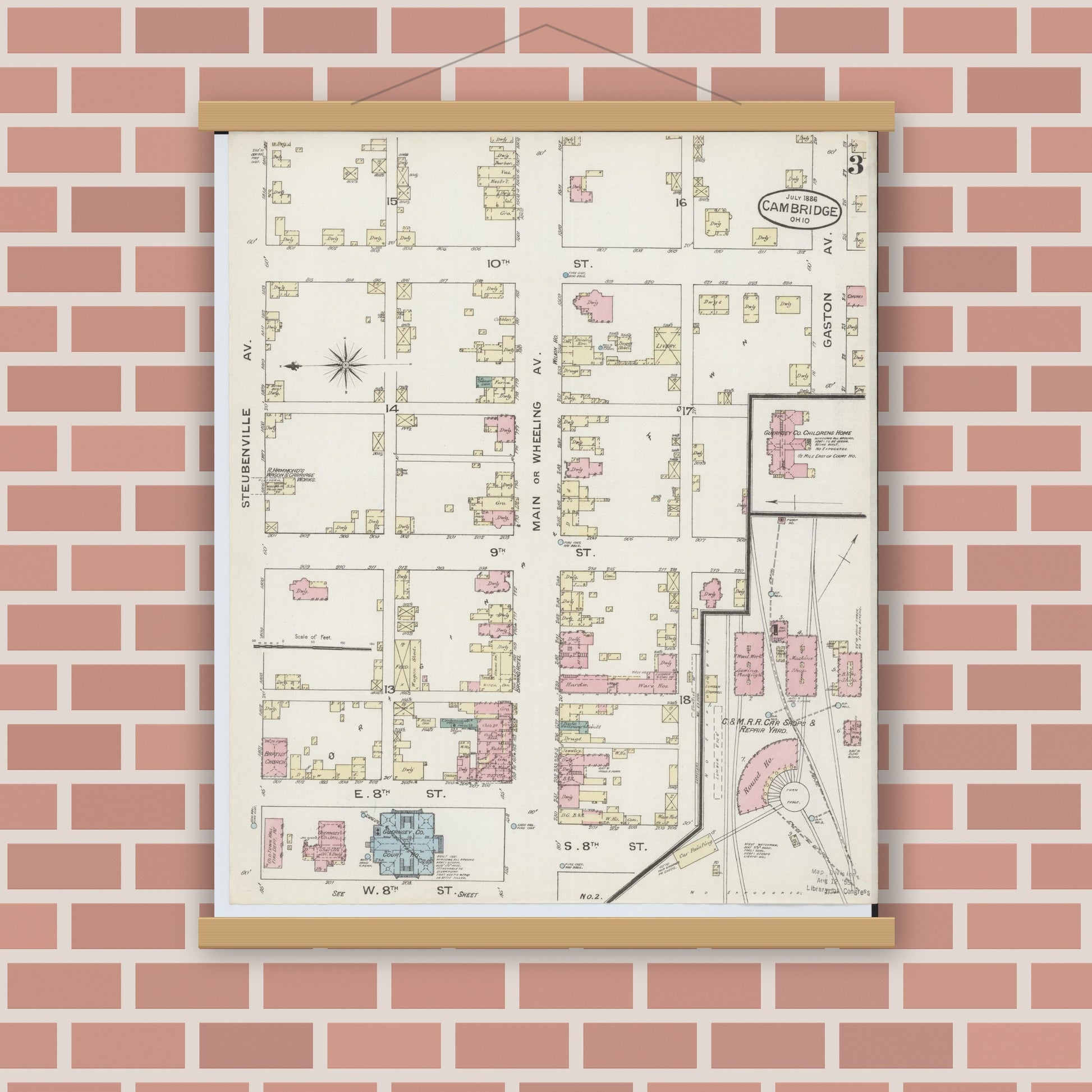Old map wall art mockup — magnetic wood frame on brick wall — Sanborn Fire Insurance Map from Cambridge, Guernsey County, Ohio (1886), Sheet #0003