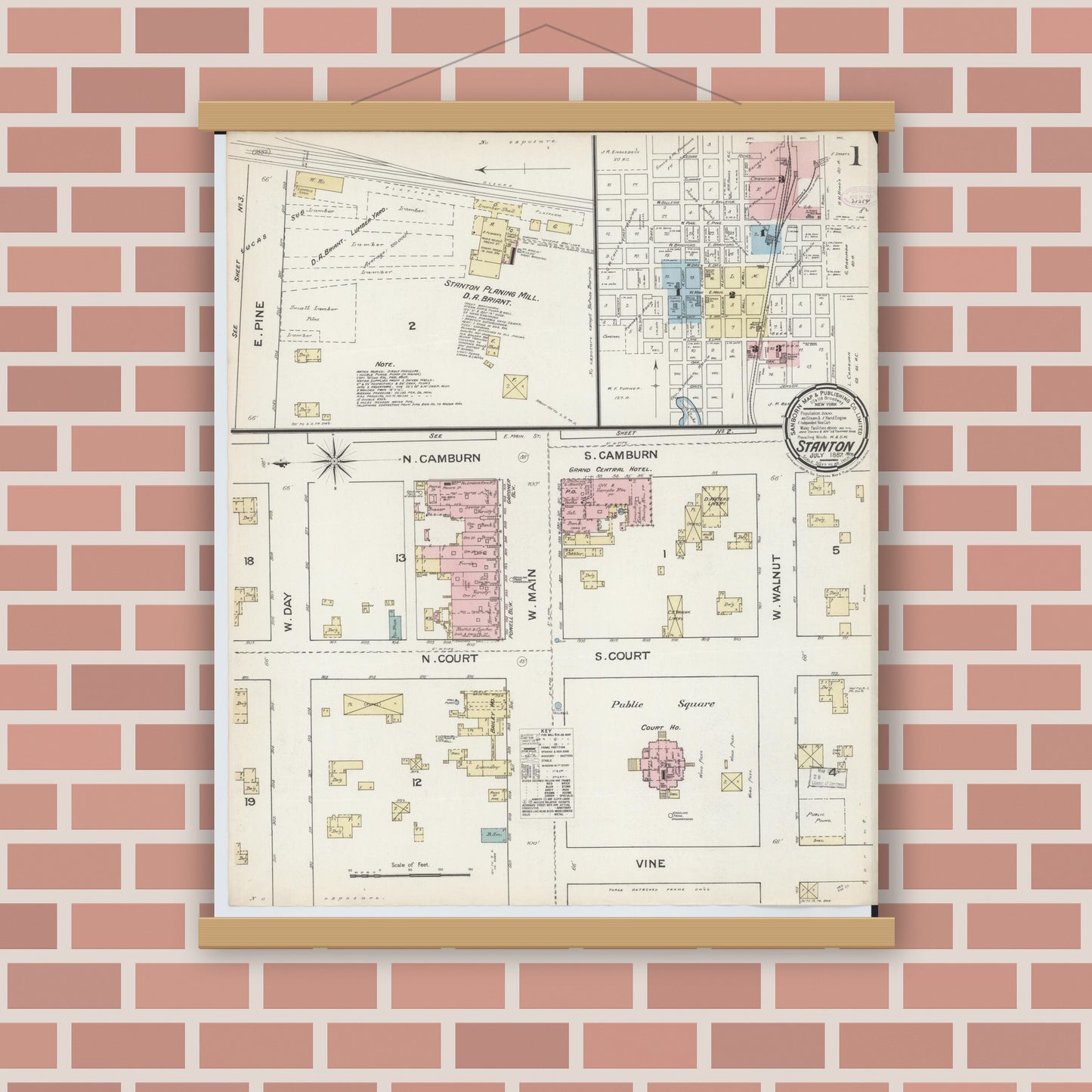 Old map wall art mockup — magnetic wood frame on brick wall — Sanborn Fire Insurance Map from Stanton, Montcalm County, Michigan (1887) - Complete Map Set