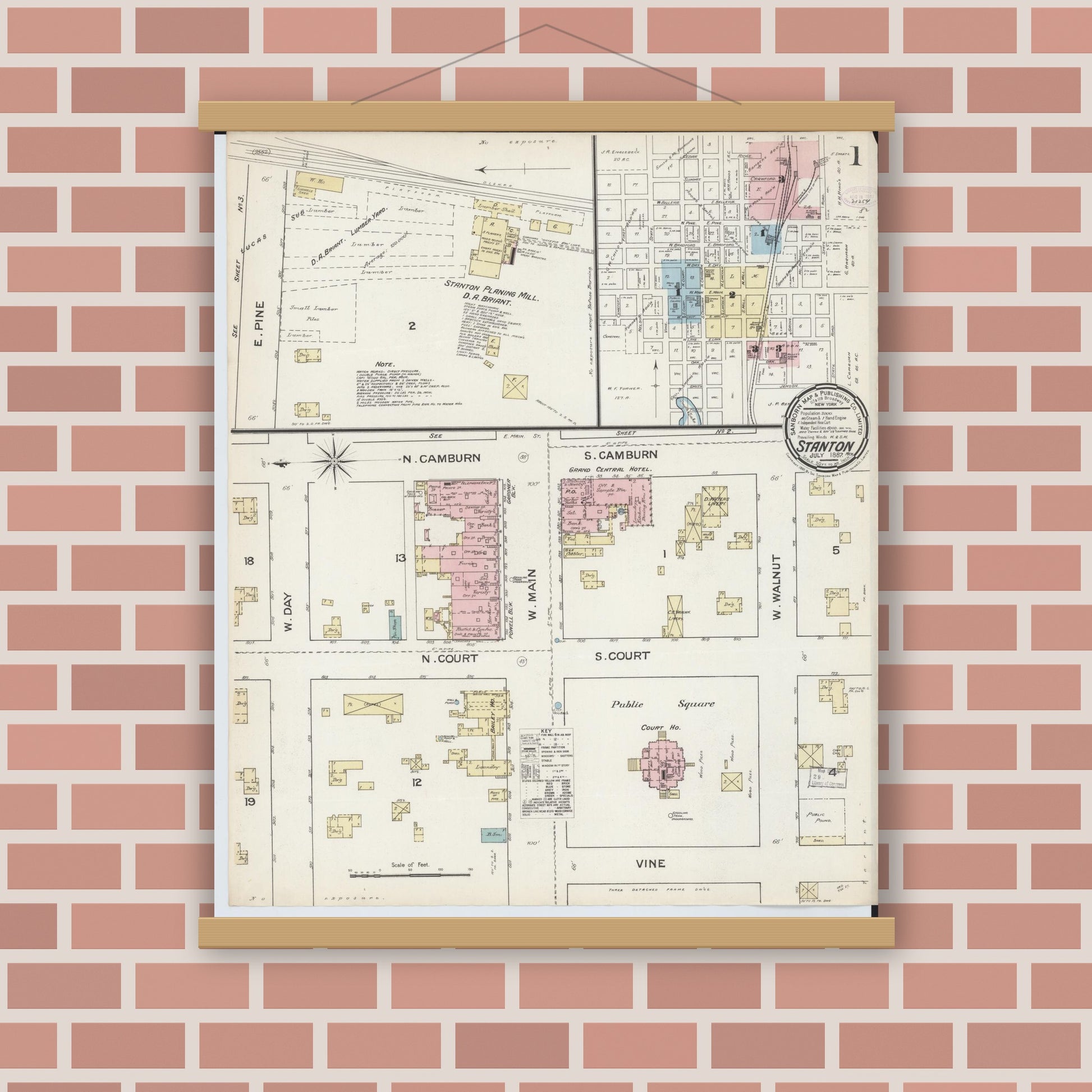 Old map wall art mockup — magnetic wood frame on brick wall — Sanborn Fire Insurance Map from Stanton, Montcalm County, Michigan (1887) - Complete Map Set