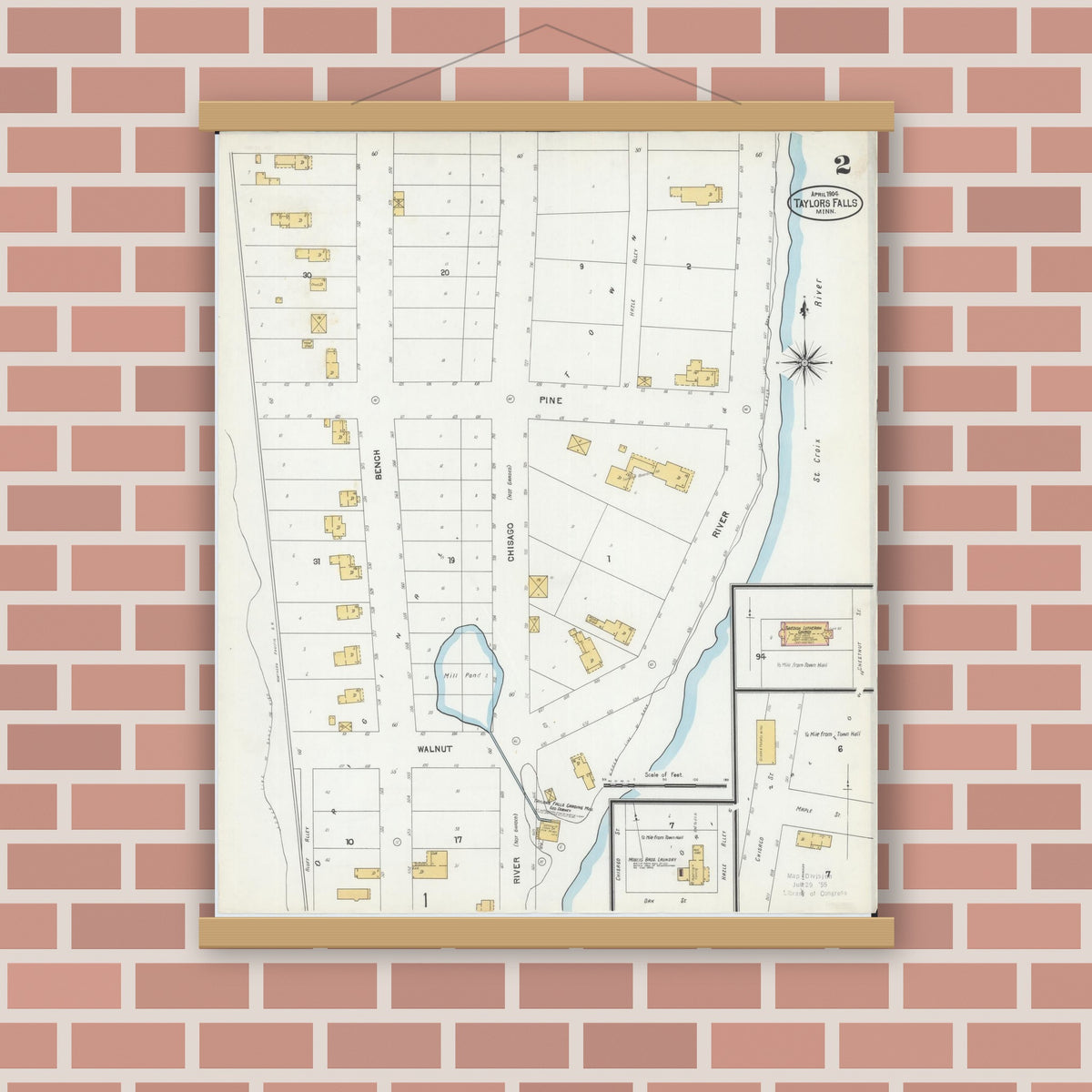 Old map wall art mockup — magnetic wood frame on brick wall — Sanborn Fire Insurance Map from Taylors Falls, Chisago County, Minnesota (1904), Sheet #0002