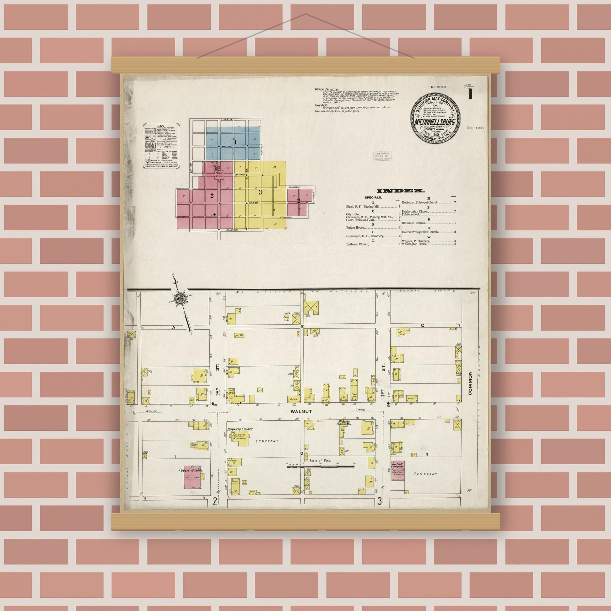 Old map wall art mockup — magnetic wood frame on brick wall — Sanborn Fire Insurance Map from McConnellsburgh, Fulton County, Pennsylvania (1910), Sheet #0001