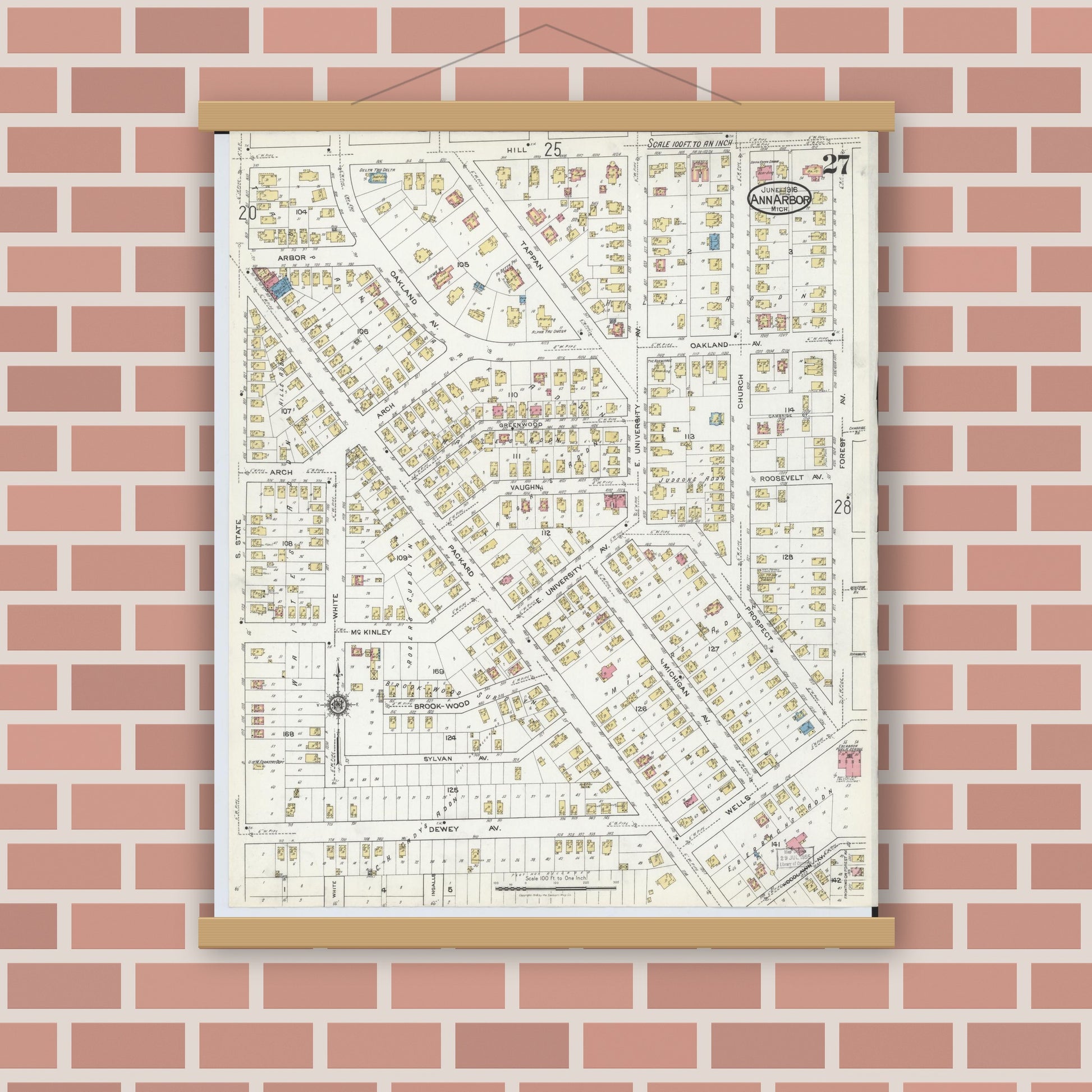 Old map wall art mockup — magnetic wood frame on brick wall — Sanborn Fire Insurance Map from Ann Arbor, Washtenaw County, Michigan (1916), Sheet #0027