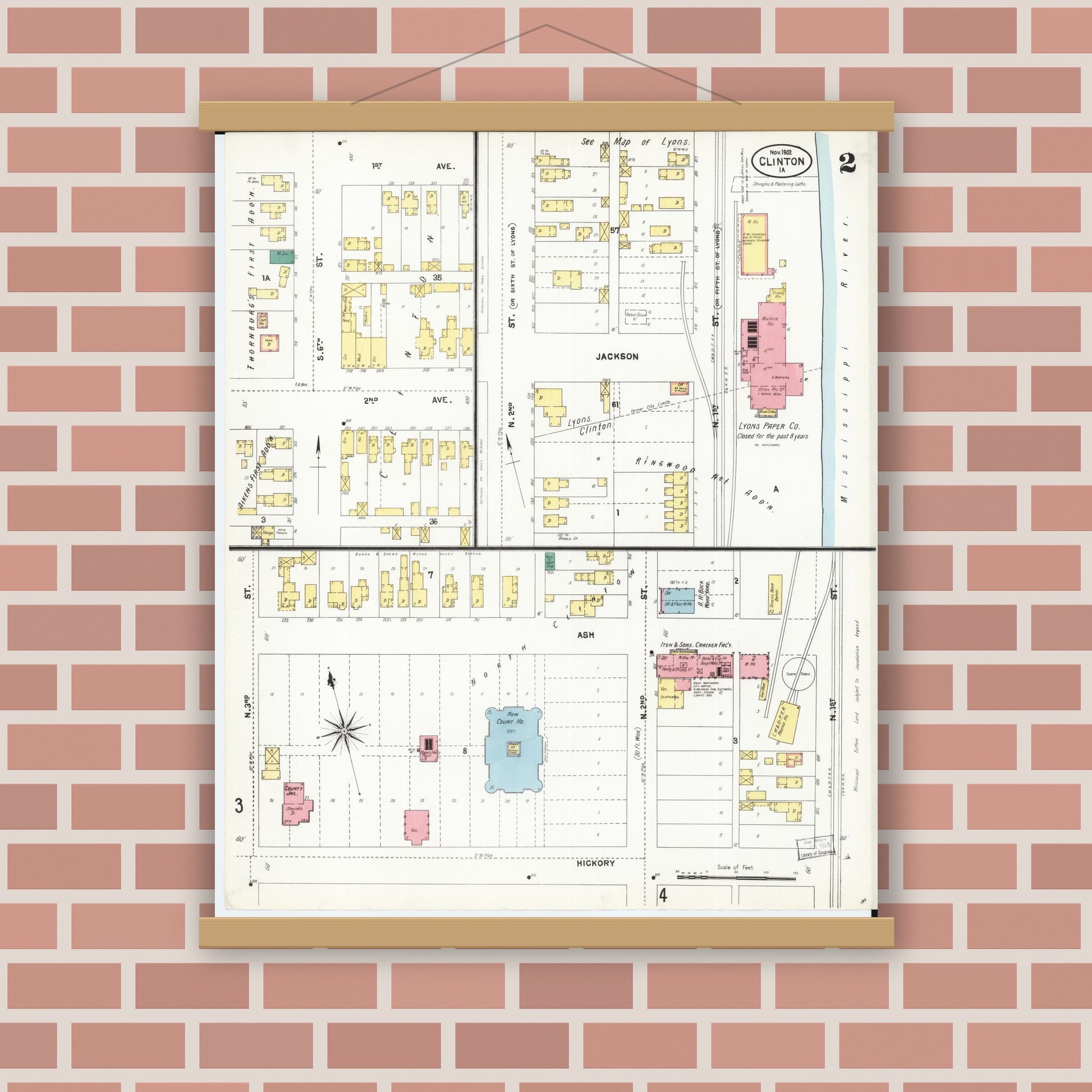 Old map wall art mockup — magnetic wood frame on brick wall — Sanborn Fire Insurance Map from Clinton, Clinton County, Iowa (1902), Sheet #0002