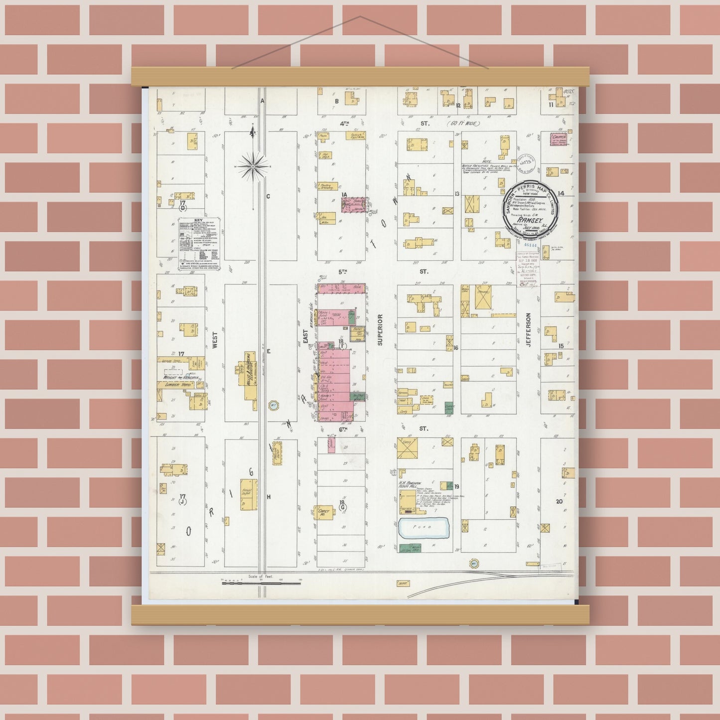 Old map wall art mockup — magnetic wood frame on brick wall — Sanborn Fire Insurance Map from Ramsey, Fayette County, Illinois (1900), Sheet #0001