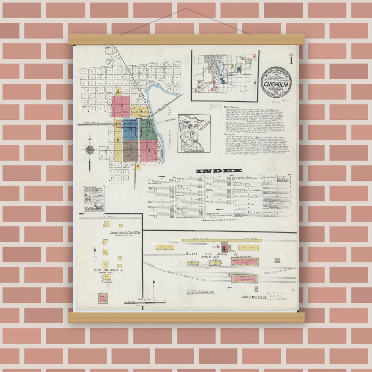 Old map wall art mockup — magnetic wood frame on brick wall — Sanborn Fire Insurance Map from Chisholm, Saint Louis County, Minnesota (1921), Sheet #0001