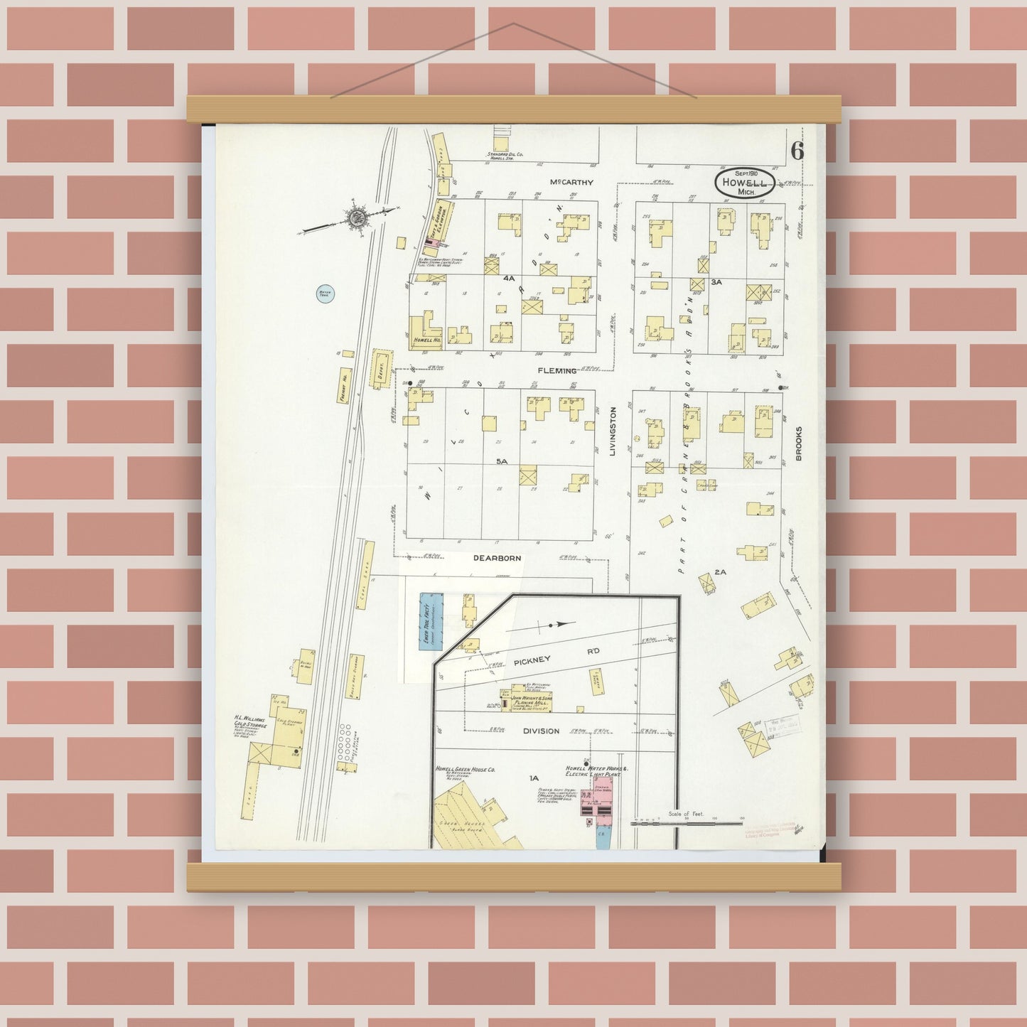 Old map wall art mockup — magnetic wood frame on brick wall — Sanborn Fire Insurance Map from Howell, Livingston County, Michigan (1910), Sheet #0006