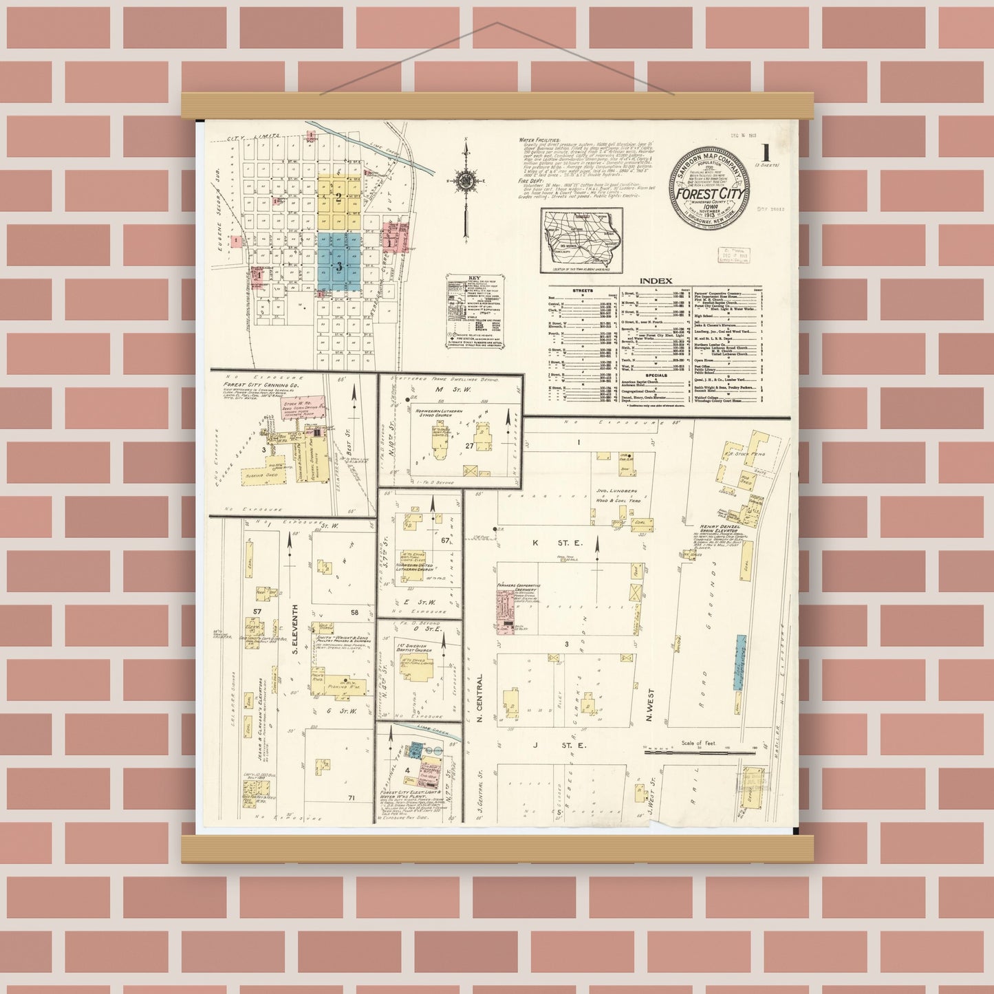 Old map wall art mockup — magnetic wood frame on brick wall — Sanborn Fire Insurance Map from Forest City, Winnebago County, Iowa (1913), Sheet #0001