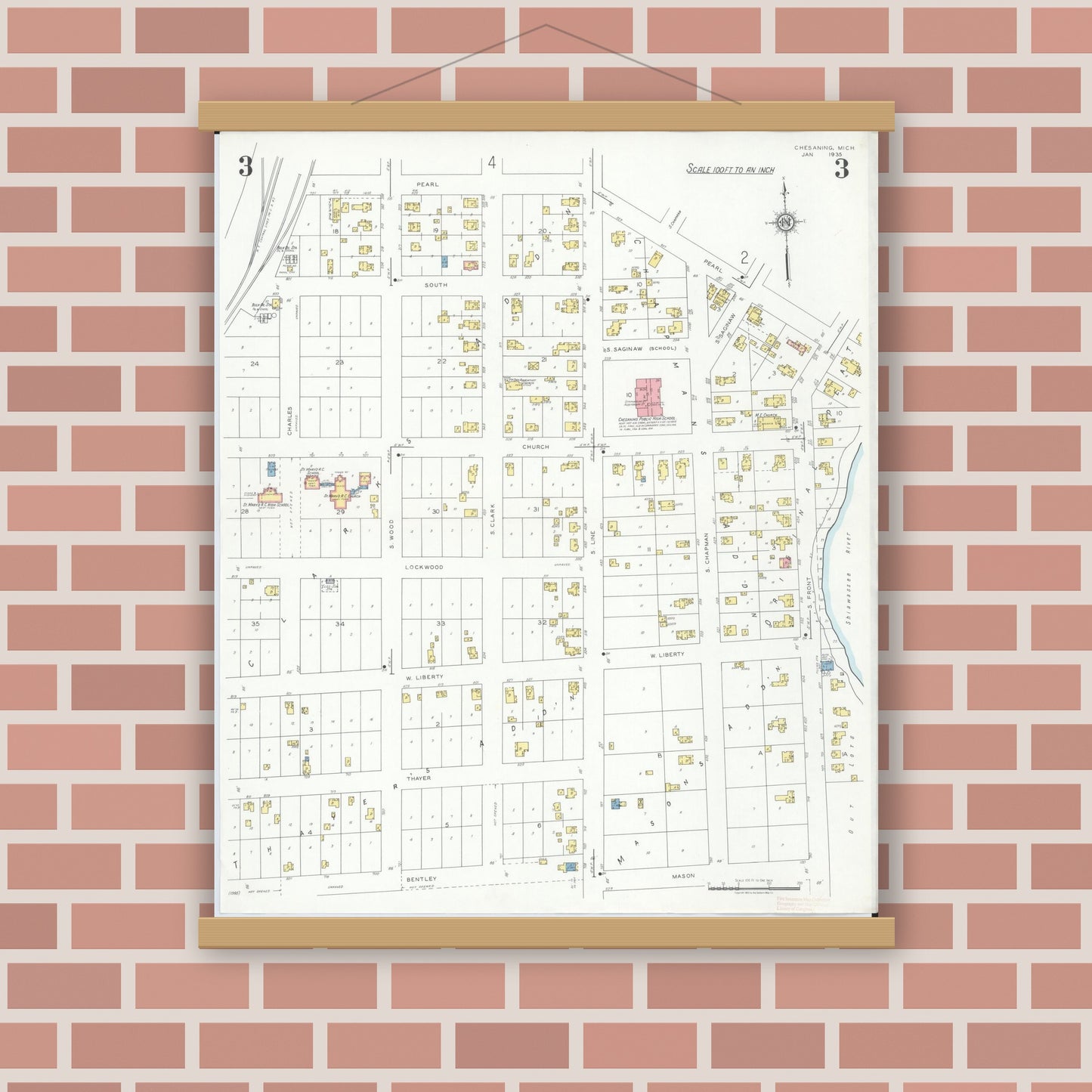 Old map wall art mockup — magnetic wood frame on brick wall — Sanborn Fire Insurance Map from Chesaning, Saginaw County, Michigan (1935), Sheet #0003