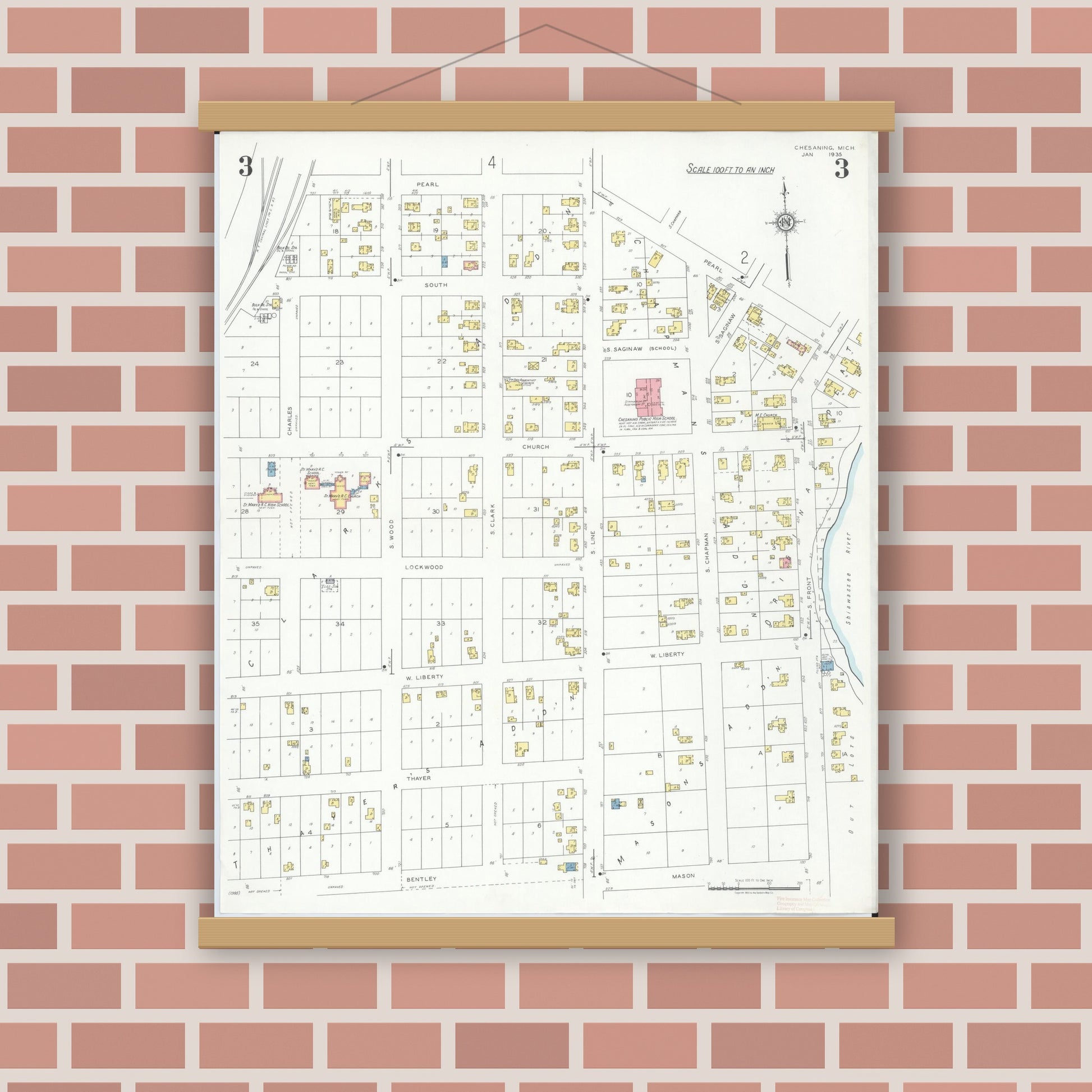 Old map wall art mockup — magnetic wood frame on brick wall — Sanborn Fire Insurance Map from Chesaning, Saginaw County, Michigan (1935), Sheet #0003
