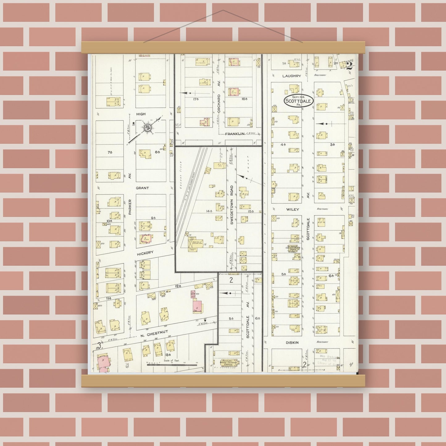 Old map wall art mockup — magnetic wood frame on brick wall — Sanborn Fire Insurance Map from Scottdale, Westmoreland County, Pennsylvania (1914), Sheet #0002