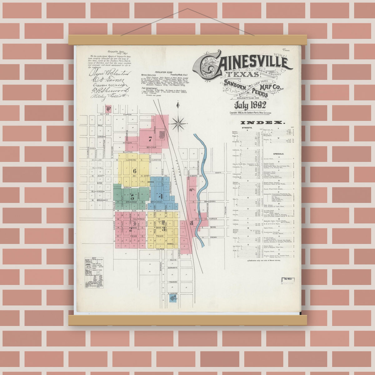 Old map wall art mockup — magnetic wood frame on brick wall — Sanborn Fire Insurance Map from Gainesville, Cooke County, Texas (1892), Sheet #0001