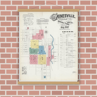 Old map wall art mockup — magnetic wood frame on brick wall — Sanborn Fire Insurance Map from Gainesville, Cooke County, Texas (1892), Sheet #0001