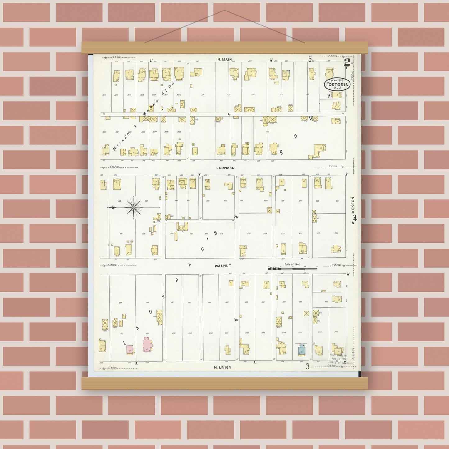 Old map wall art mockup — magnetic wood frame on brick wall — Sanborn Fire Insurance Map from Fostoria, Seneca, Hancock, And Wood Counties, Ohio (1908), Sheet #0002