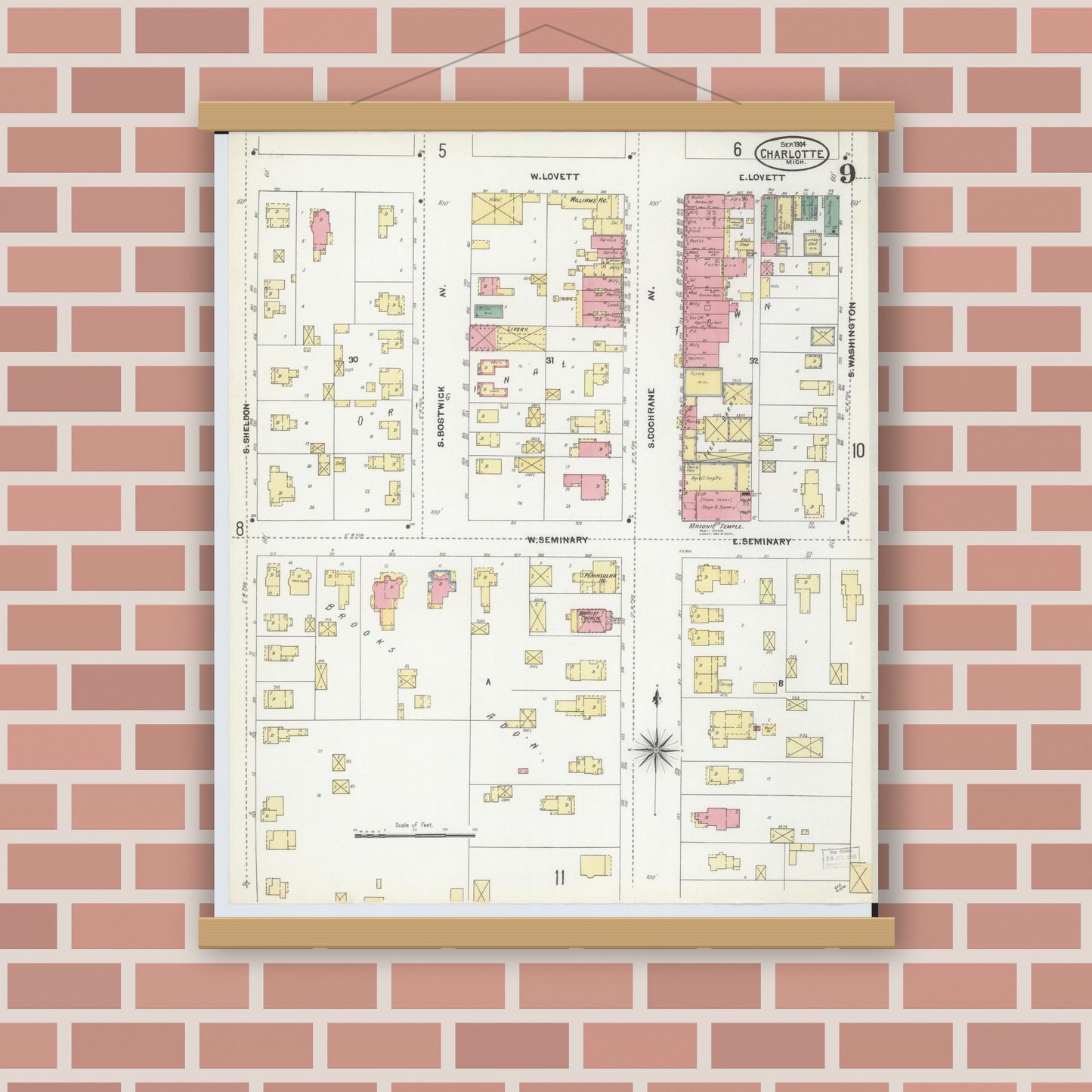 Old map wall art mockup — magnetic wood frame on brick wall — Sanborn Fire Insurance Map from Charlotte, Eaton County, Michigan (1904), Sheet #0009