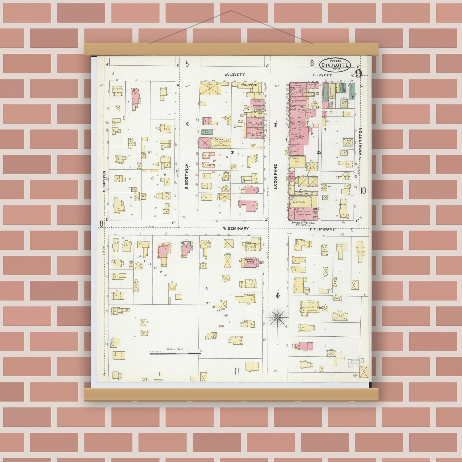 Old map wall art mockup — magnetic wood frame on brick wall — Sanborn Fire Insurance Map from Charlotte, Eaton County, Michigan (1904), Sheet #0009