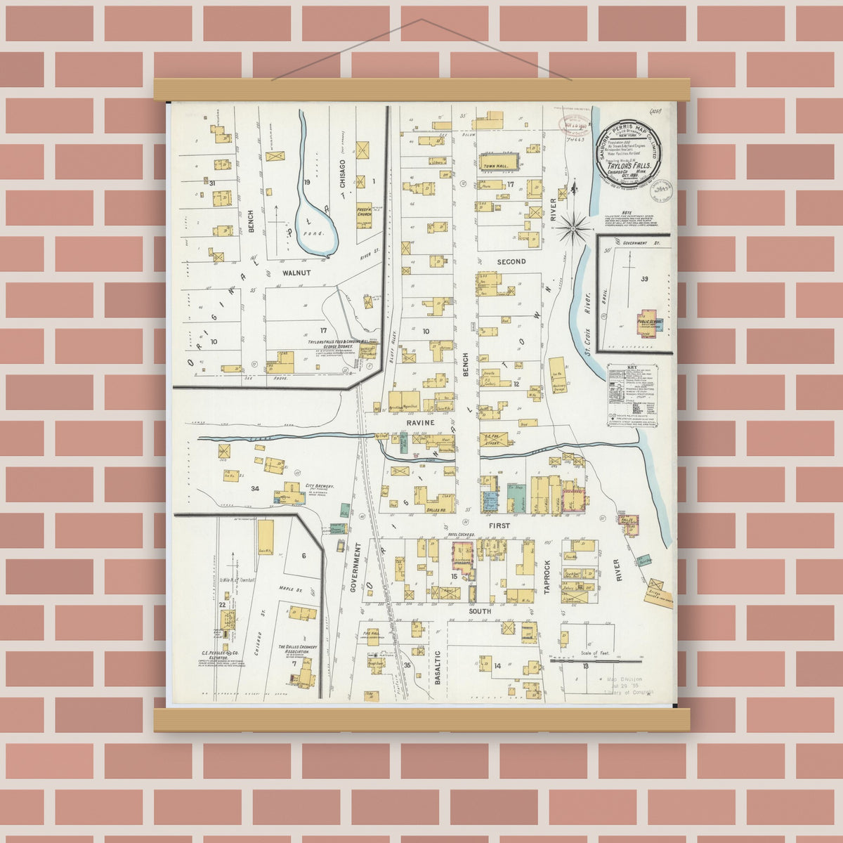 Old map wall art mockup — magnetic wood frame on brick wall — Sanborn Fire Insurance Map from Taylors Falls, Chisago County, Minnesota (1899), Sheet #0001