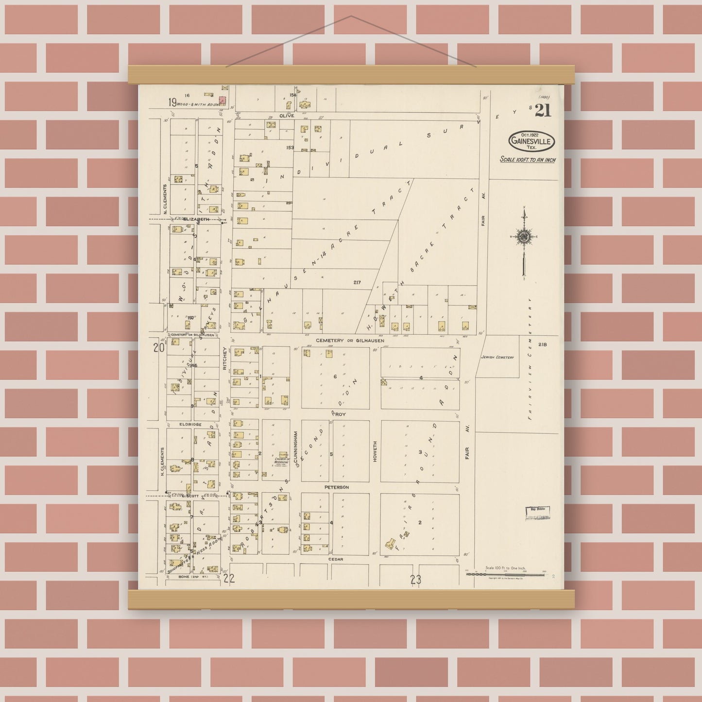 Old map wall art mockup — magnetic wood frame on brick wall — Sanborn Fire Insurance Map from Gainesville, Cooke County, Texas (1922), Sheet #0021