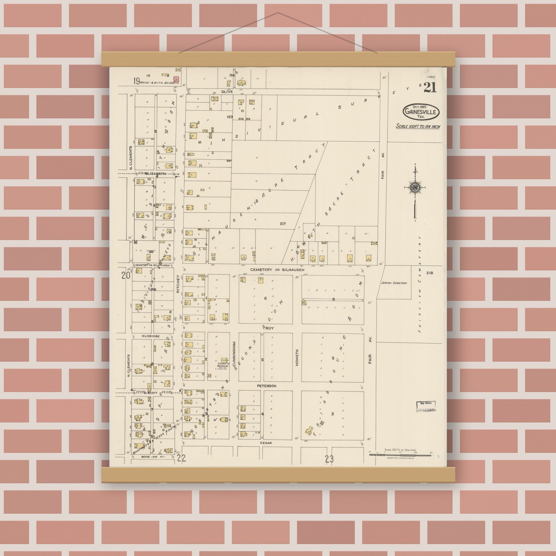Old map wall art mockup — magnetic wood frame on brick wall — Sanborn Fire Insurance Map from Gainesville, Cooke County, Texas (1922), Sheet #0021