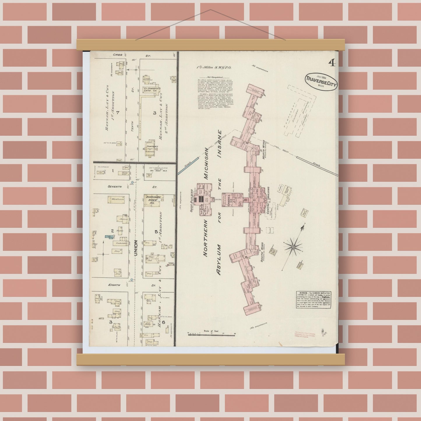 Old map wall art mockup — magnetic wood frame on brick wall — Sanborn Fire Insurance Map from Traverse City, Grand Traverse County, Michigan (1884), Sheet #0004
