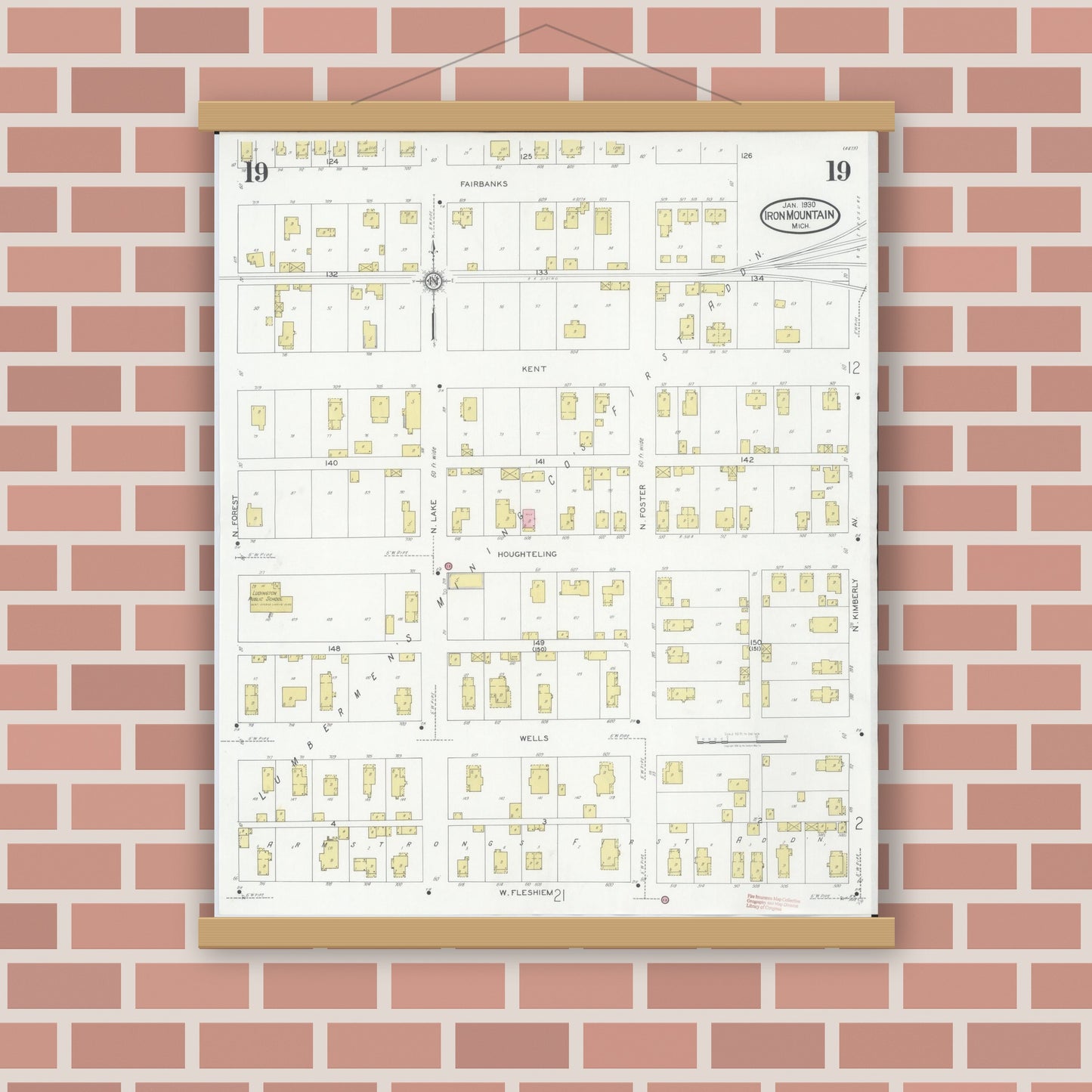 Old map wall art mockup — magnetic wood frame on brick wall — Sanborn Fire Insurance Map from Iron Mountain, Dickinson County, Michigan (1930), Sheet #0019